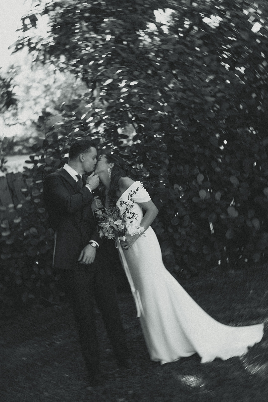 Kissing Bride & Groom couple portraits dreamy and elevated intimate backyard wedding by Aileen Ayala Photography Black and White Motion Blur