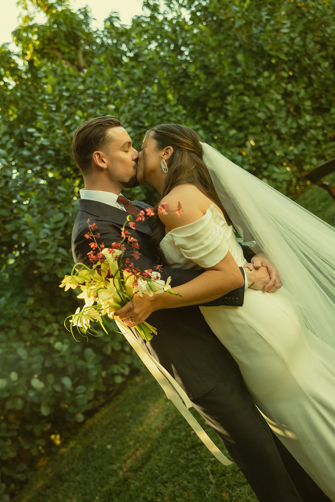 Kissing Nontraditional Bride & Groom couple portraits dreamy and elevated intimate backyard wedding by Aileen Ayala Photography