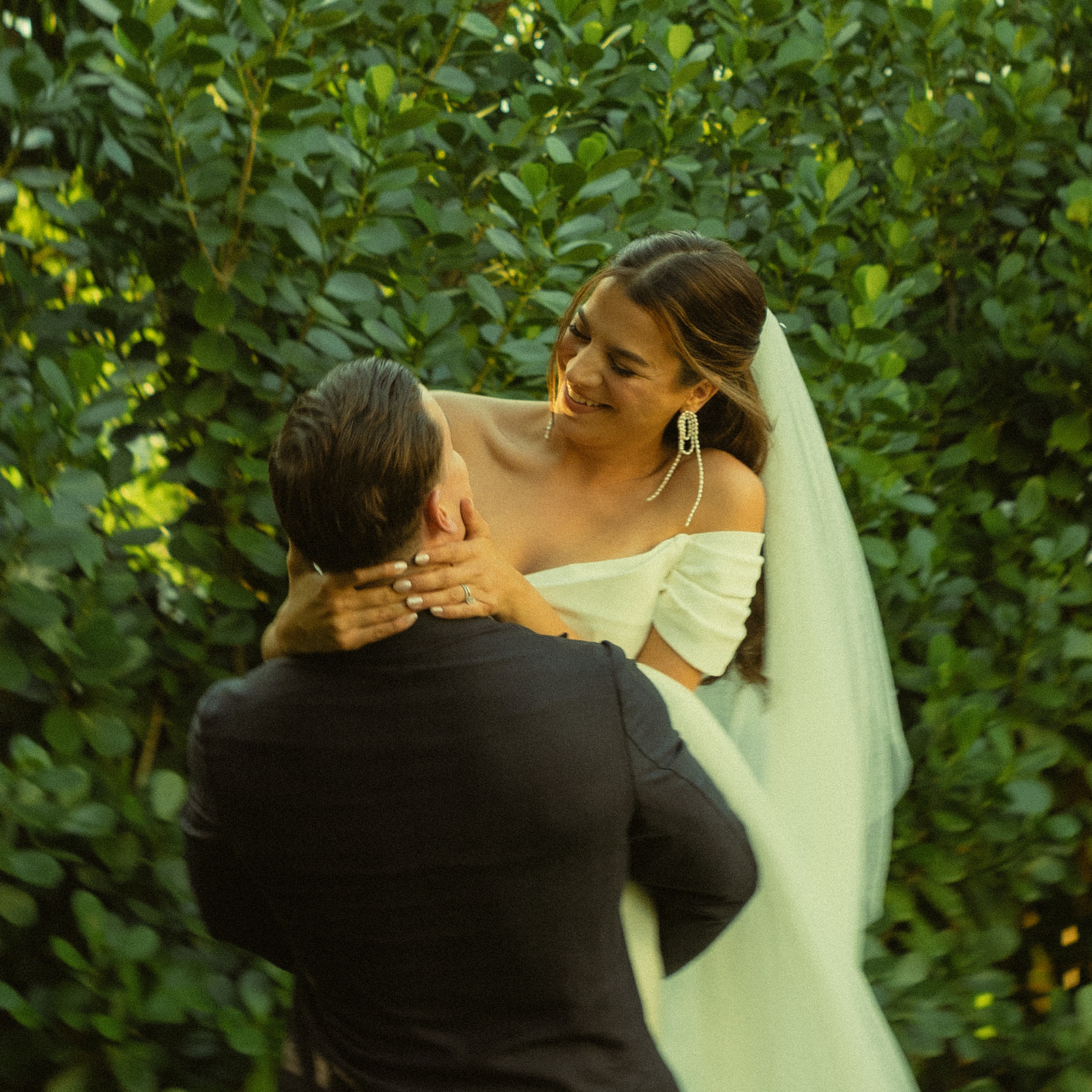 Groom carrying Bride laughing couple portraits dreamy and elevated intimate backyard wedding by Aileen Ayala Photography motion blur