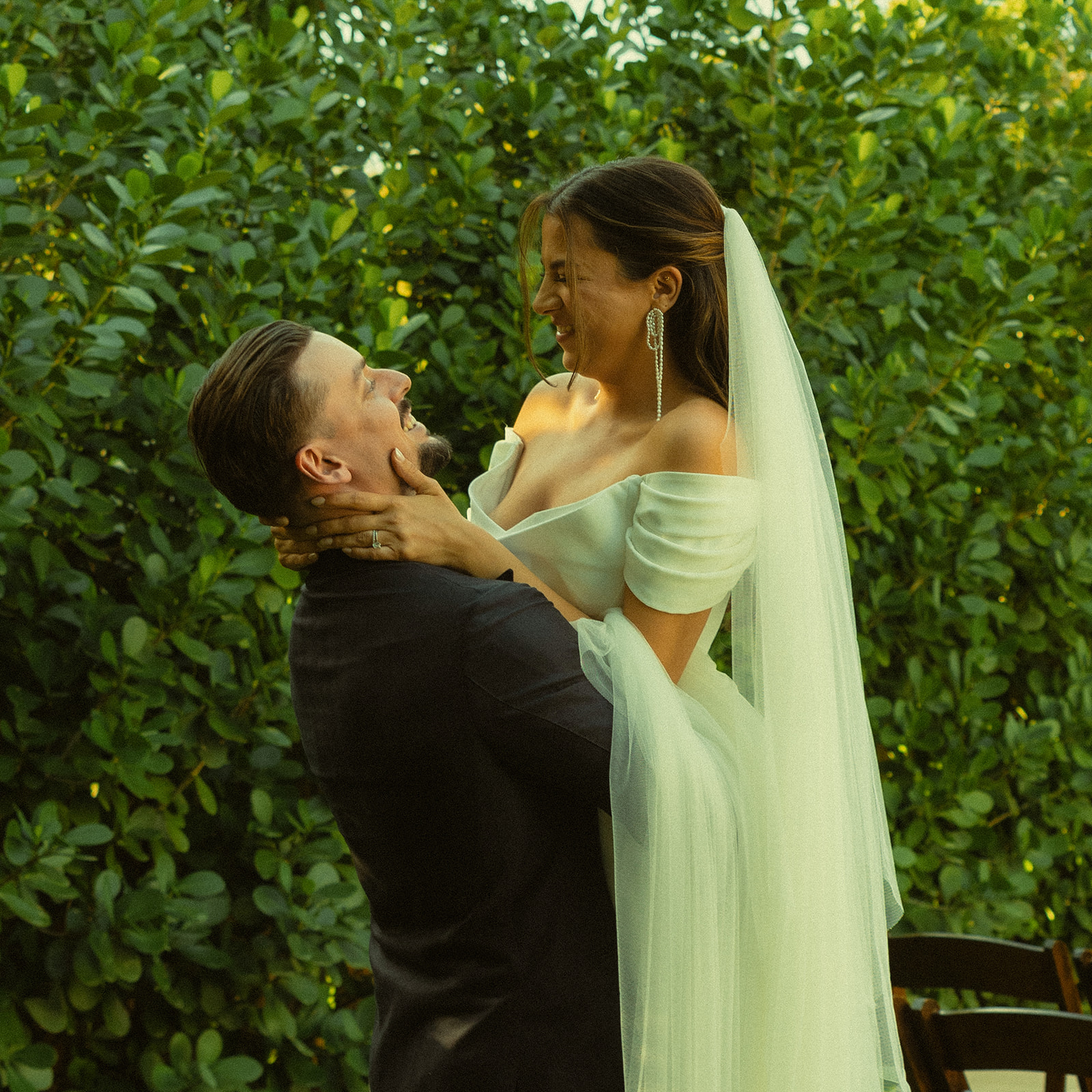 Groom carrying Bride couple portraits dreamy and elevated intimate backyard wedding by Aileen Ayala Photography