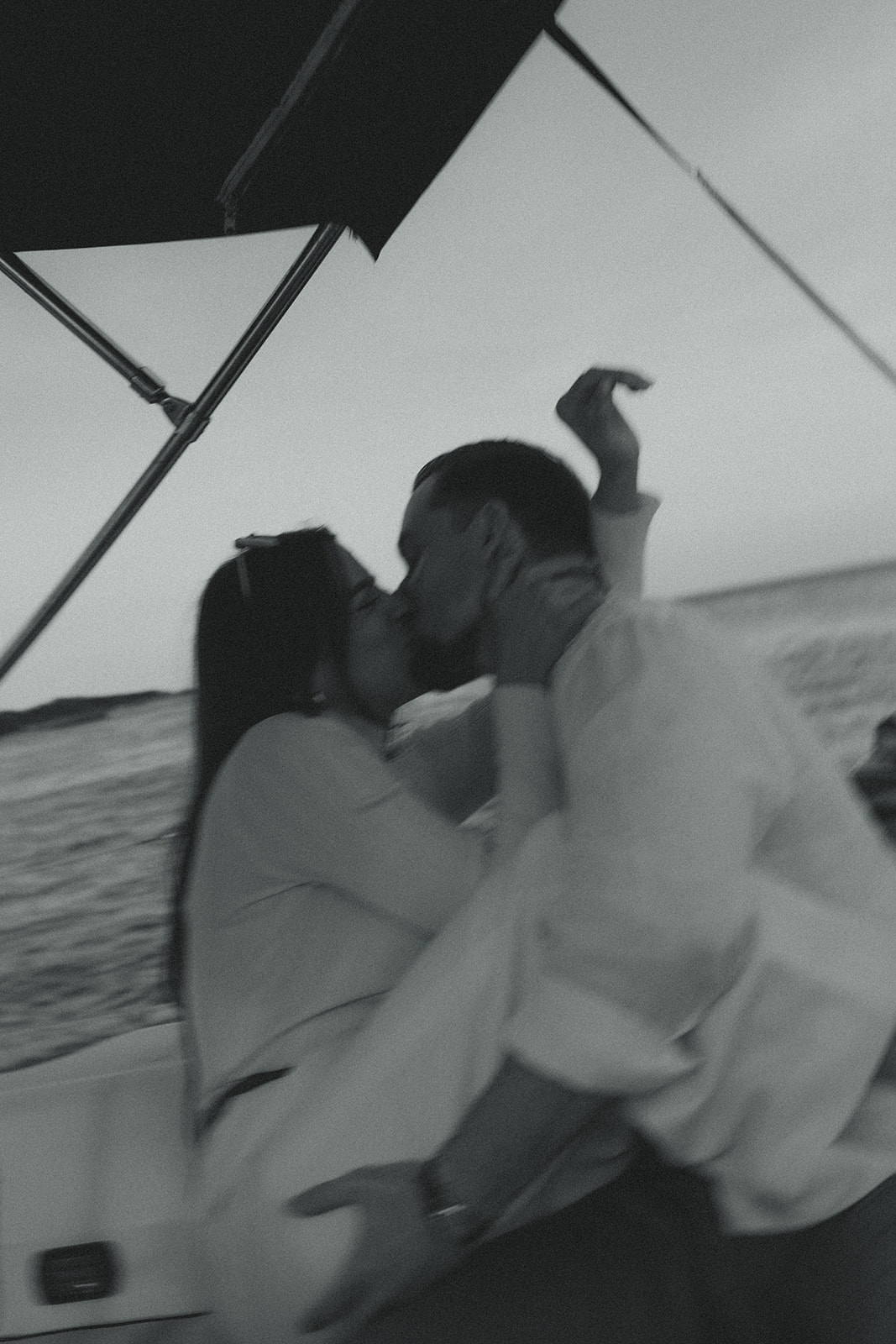 Sailboat Engagement in Miami, NYC Harbor Influence Kissing Couple Engagement Session Motion Blur Black and White