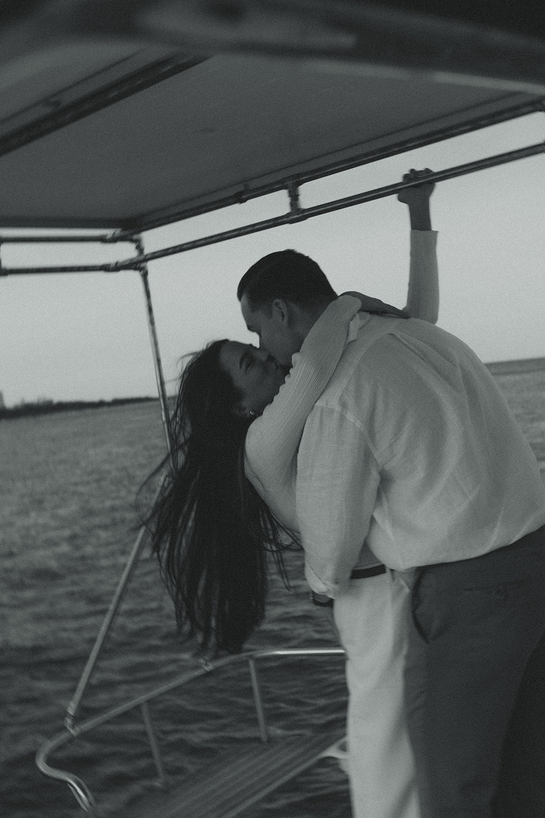 Sailboat Engagement in Miami, NYC Harbor Influence Couples Engagement Session Motion Blur B&W