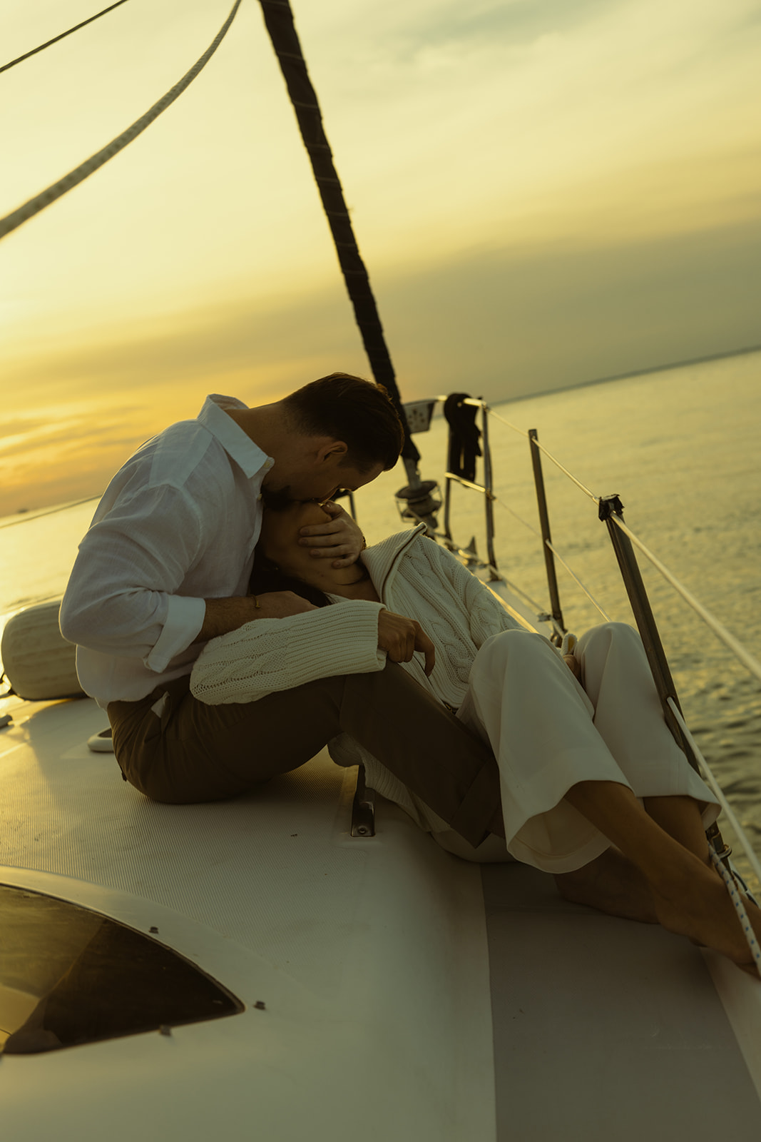 Sailboat Engagement Session in Miami, Couple Cuddled up and Kissing , NYC Harbor Inspo