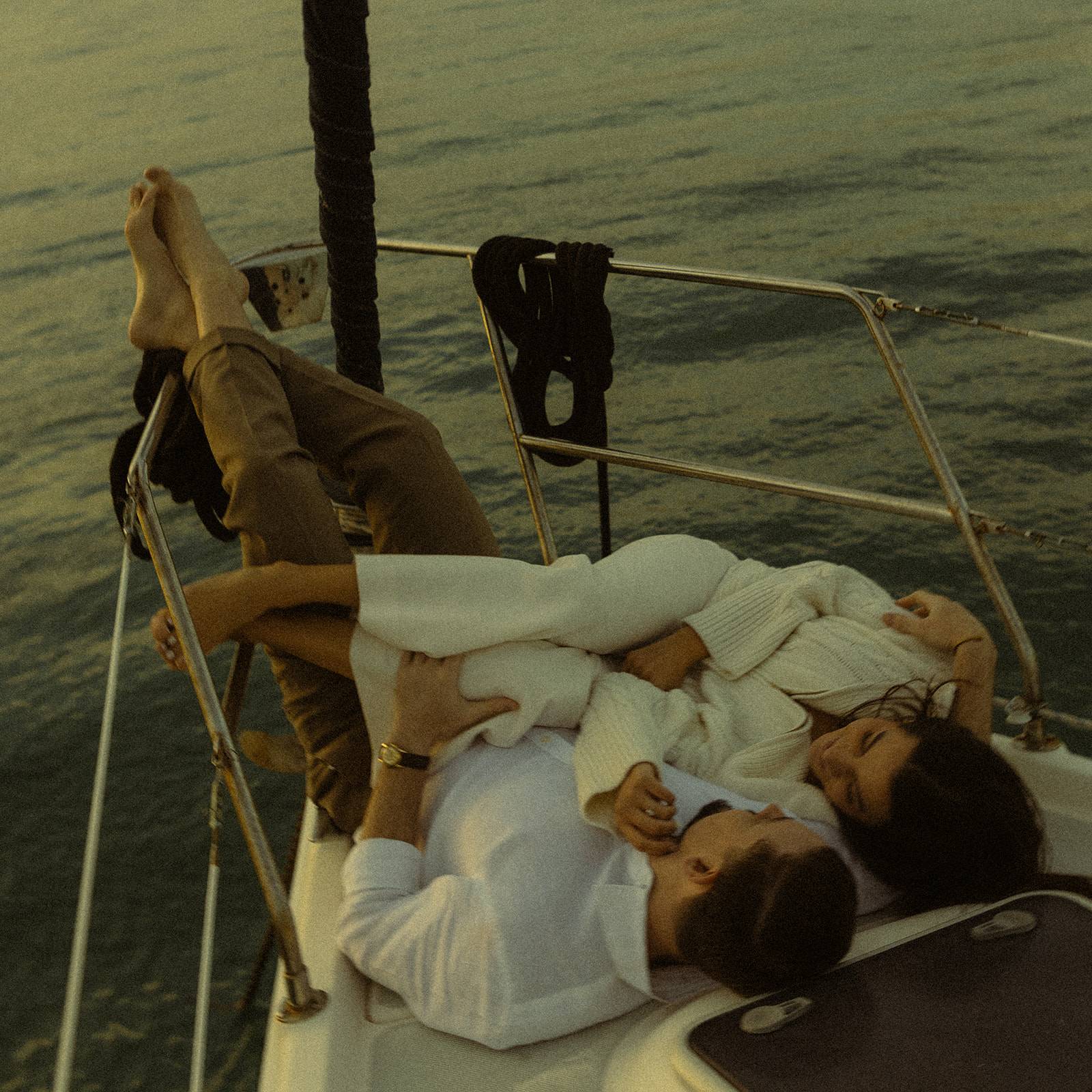 Sailboat Engagement Session in Miami, Laying on Sailboat Cuddled