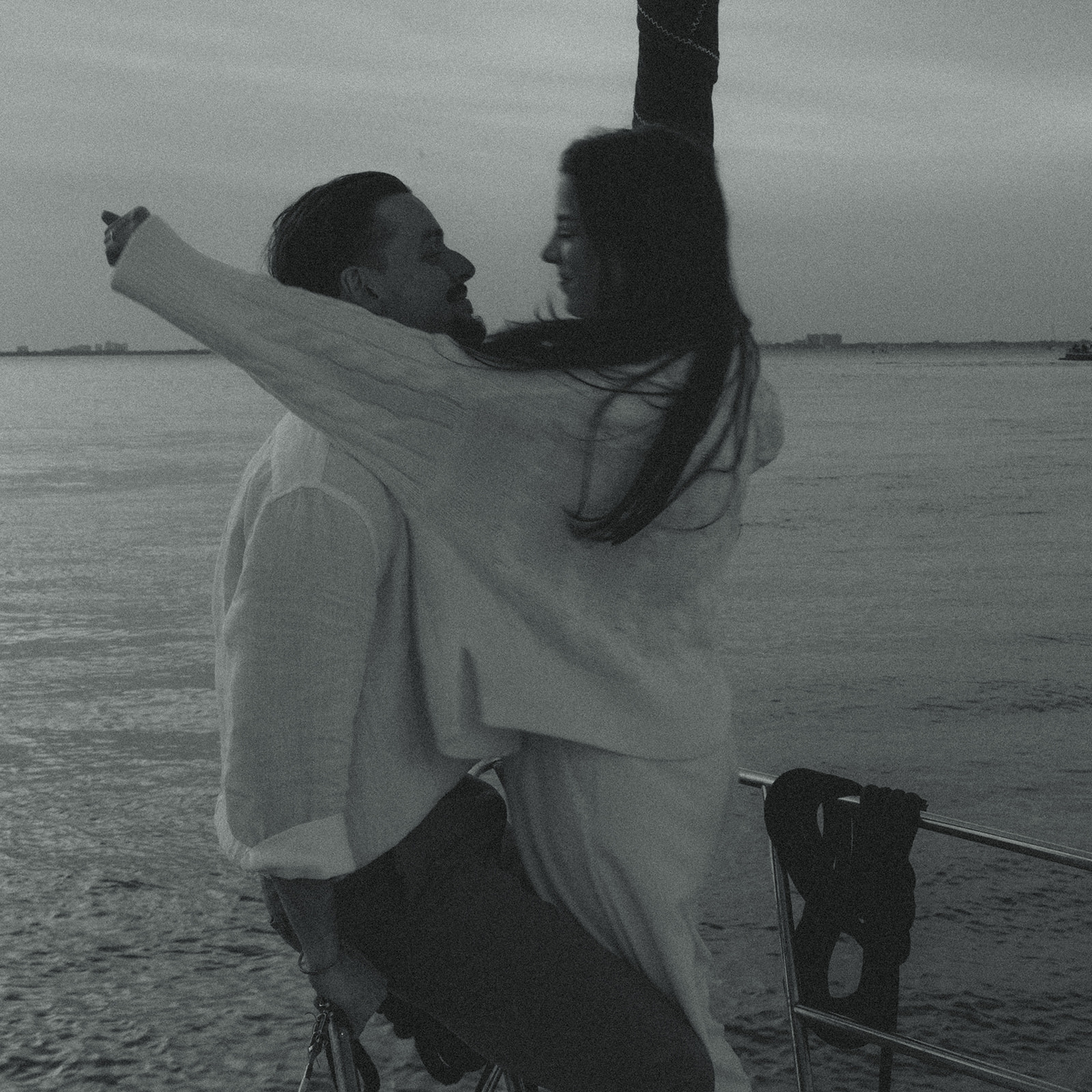 Sailboat Engagement Session in Miami, Hugging Couple Black and White