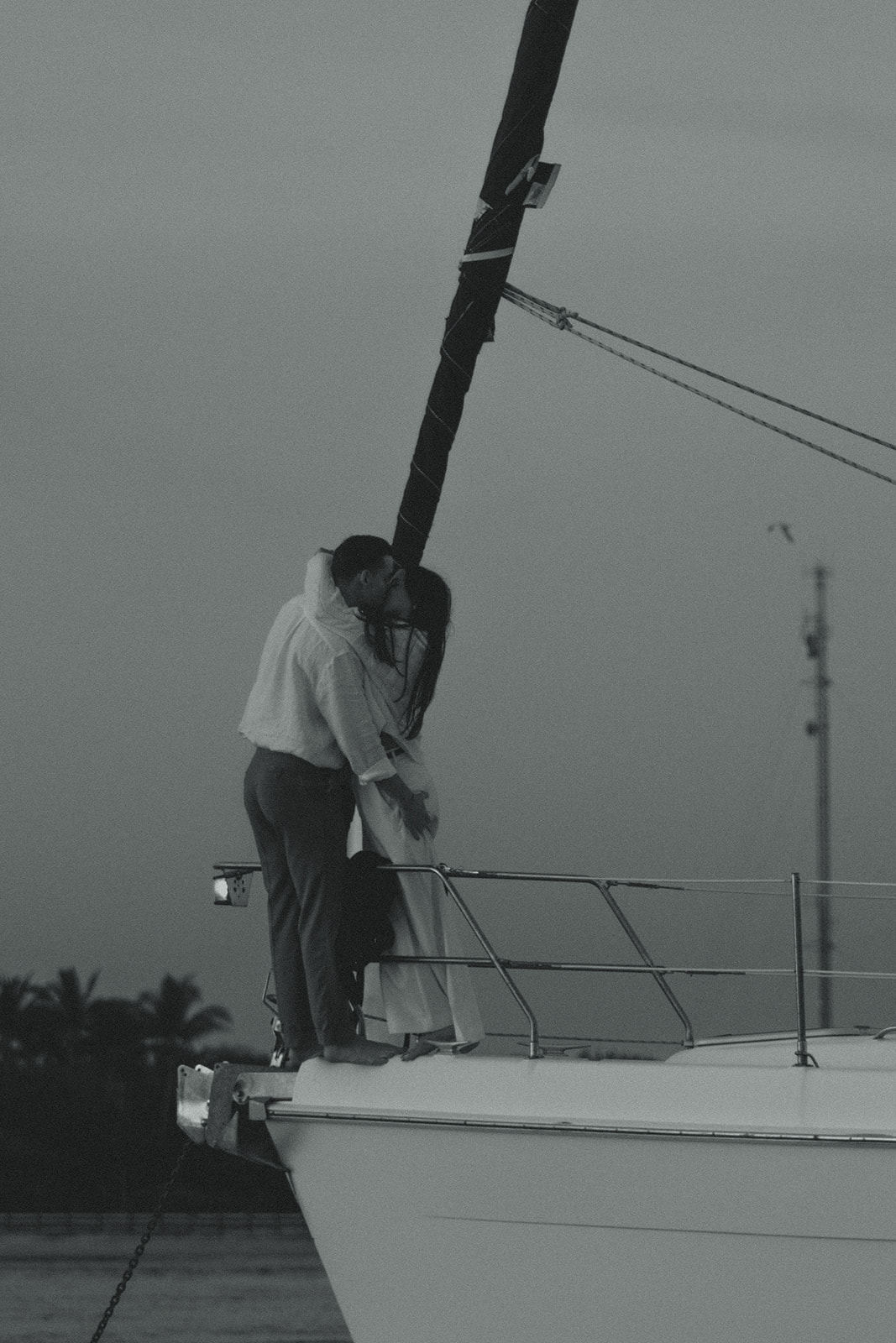 Sailboat Engagement Session in Miami, NYC Harbor B&W Kissing Couple