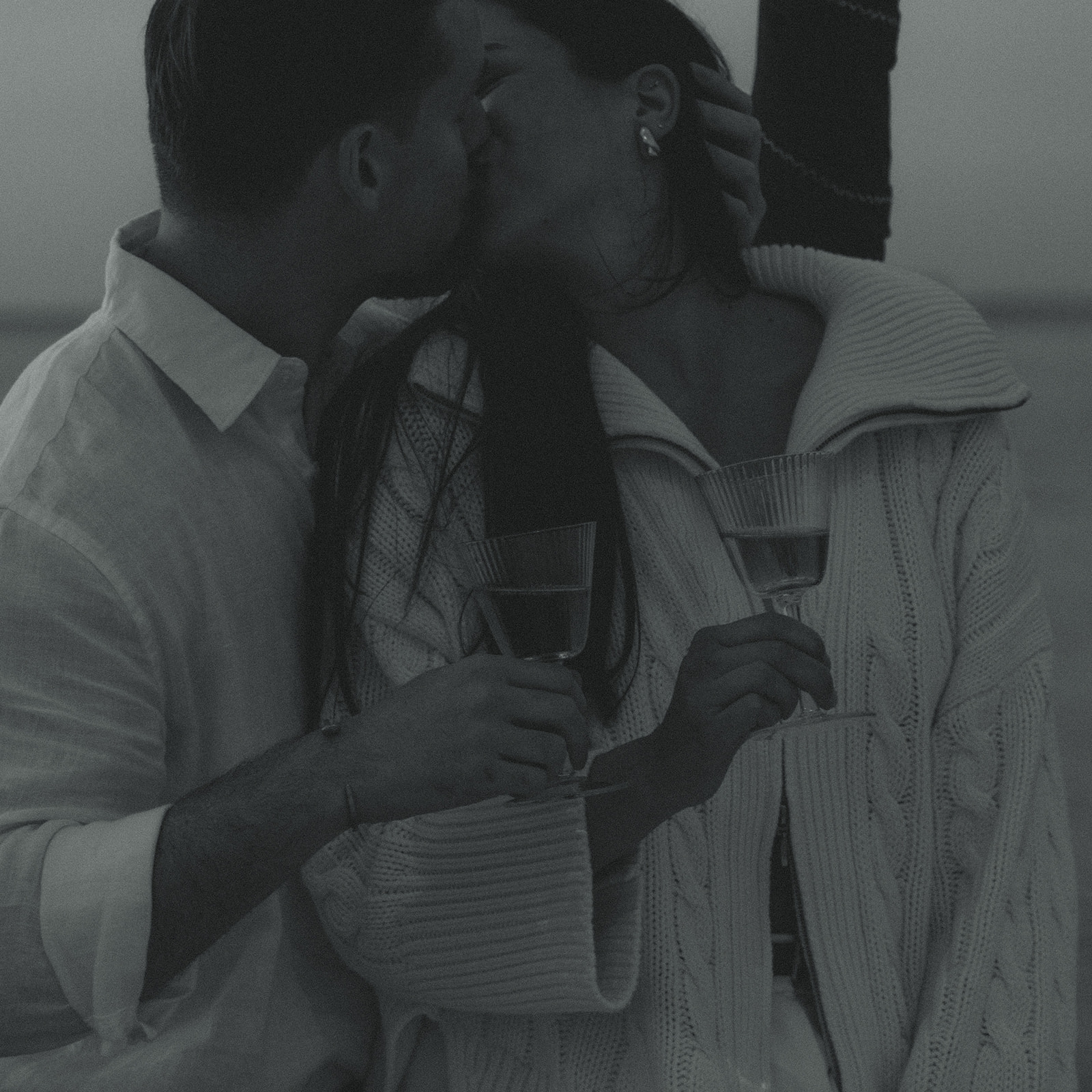 Sailboat Engagement Session in Miami, Drinking Rose and kissing couple in black and white