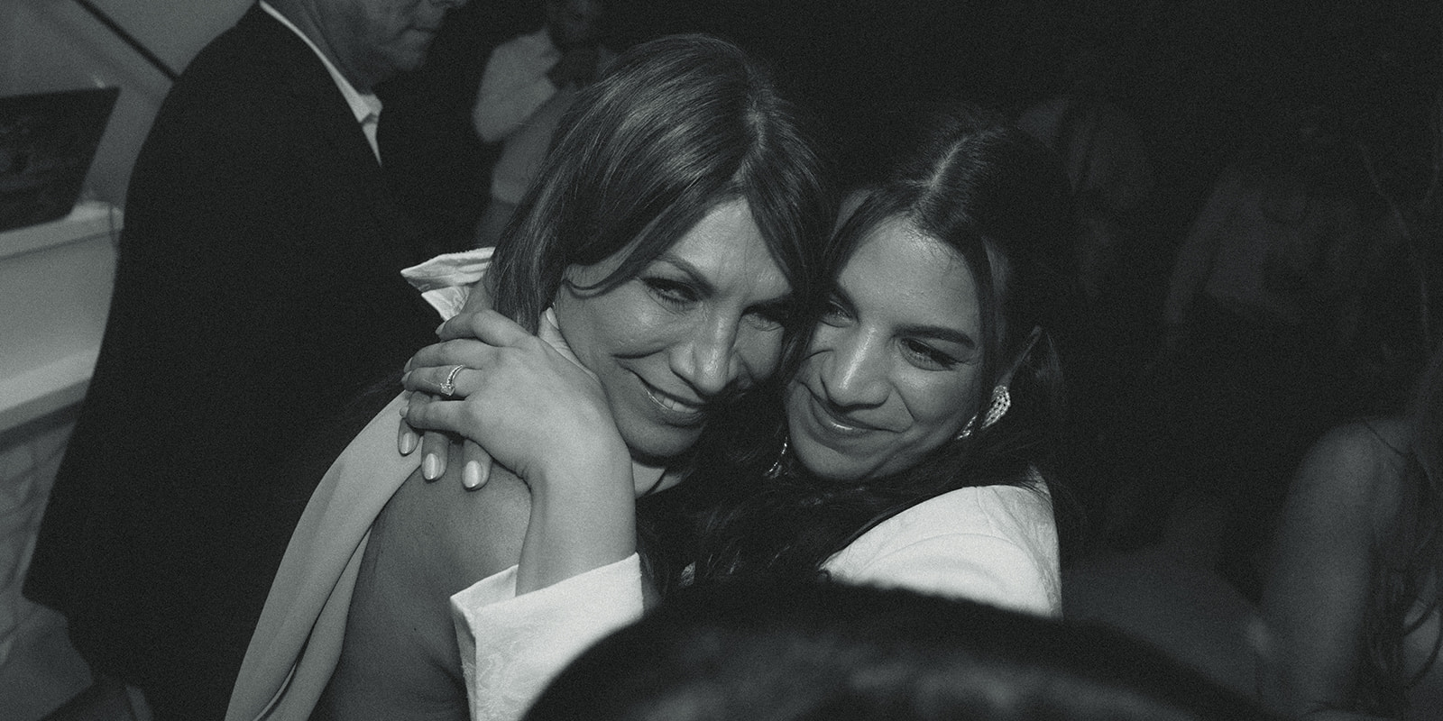 bride and mom hugging during reception dreamy and elevated intimate backyard wedding by Aileen Ayala Photography 