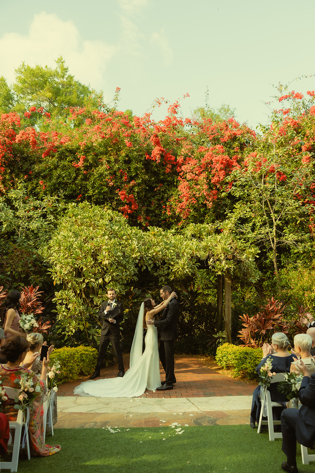 Newly Weds First Kiss in Sunken Garden Wedding Ceremony Space in St.Petersburg Documentary Wedding Photographer