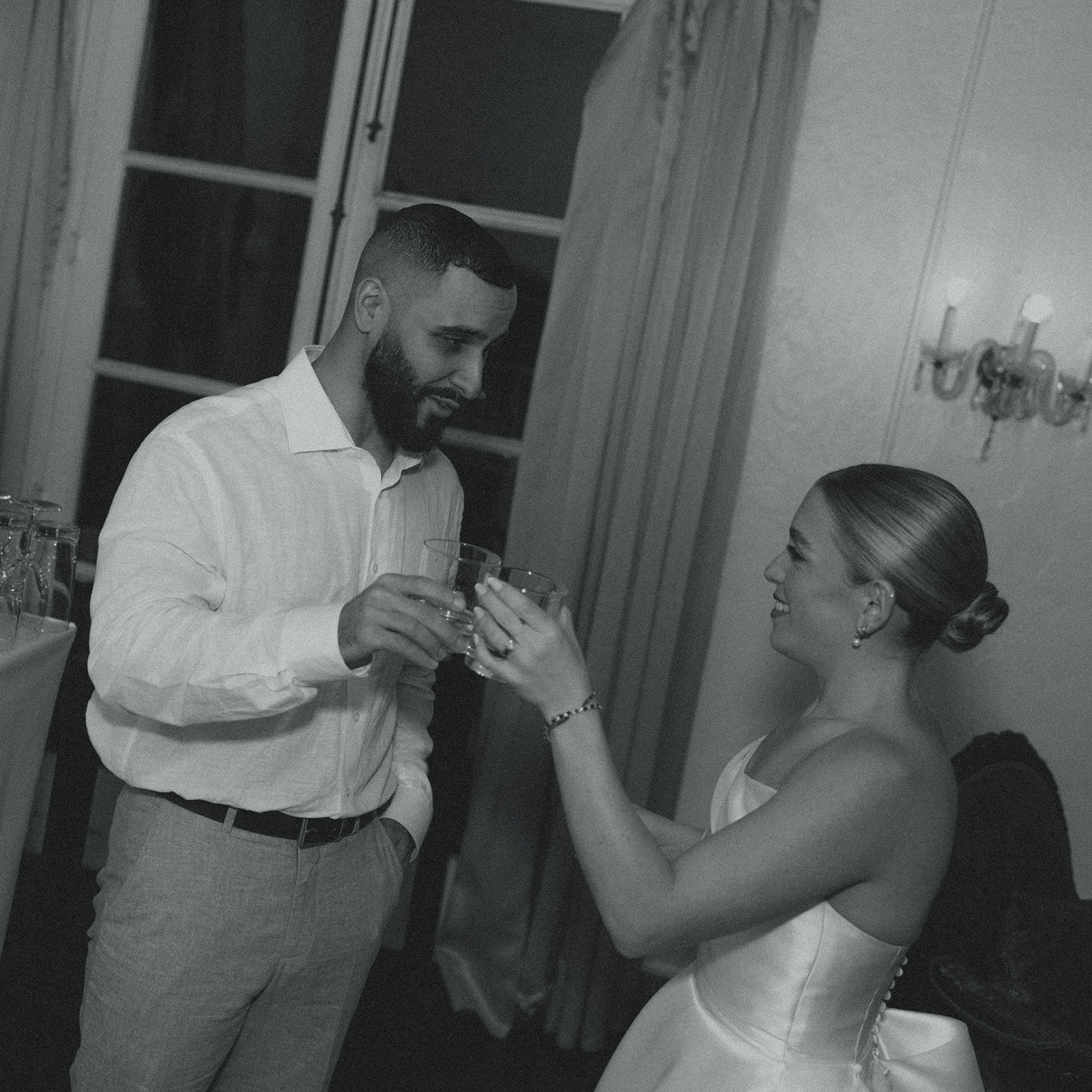 Bride & Groom Taking Shots Wedding Reception Villa Woodbine Tuscany-Inspired Venue in Miami Florida Black and White