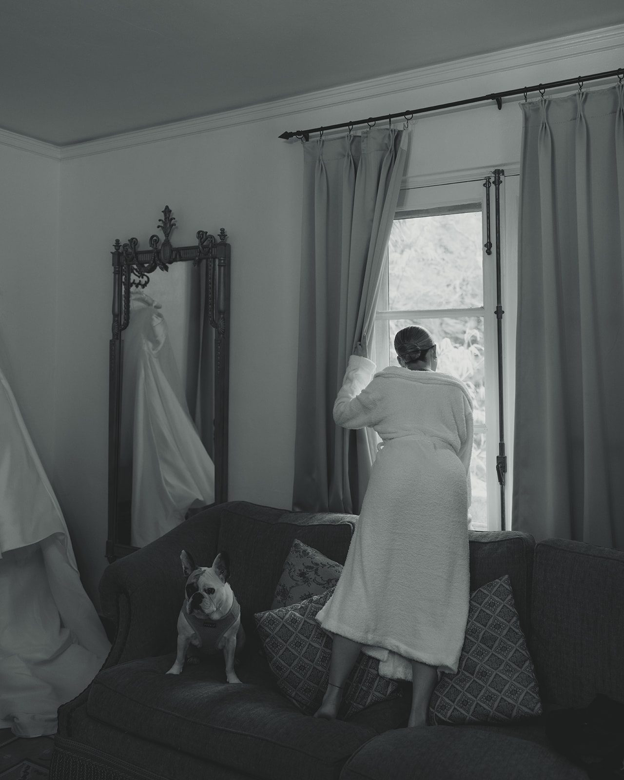 Documentary Wedding Bride Peaking Reception Space Via Window Getting Ready Suite Villa Woodbine Tuscany-Inspired Venue B&W