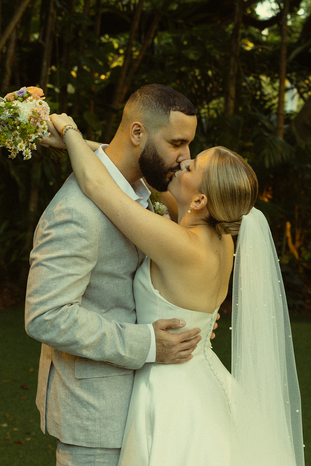 Fun and Playful Newly Weds Couple Portraits Villa Woodbine Tuscany-Inspired Venue in Miami Florida Twinkle Lights Kissing Couple