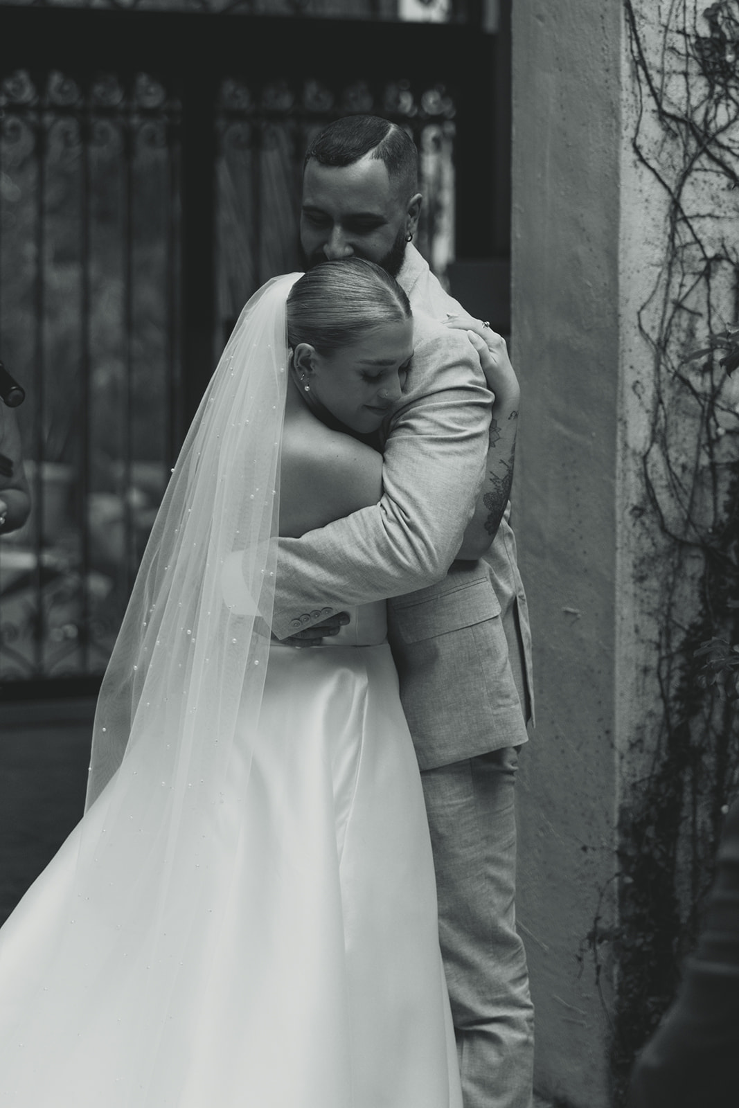 Documentary Wedding Ceremony Candid Villa Woodbine Tuscany-Inspired Venue in Miami Florida Hugging Newly Weds B&W