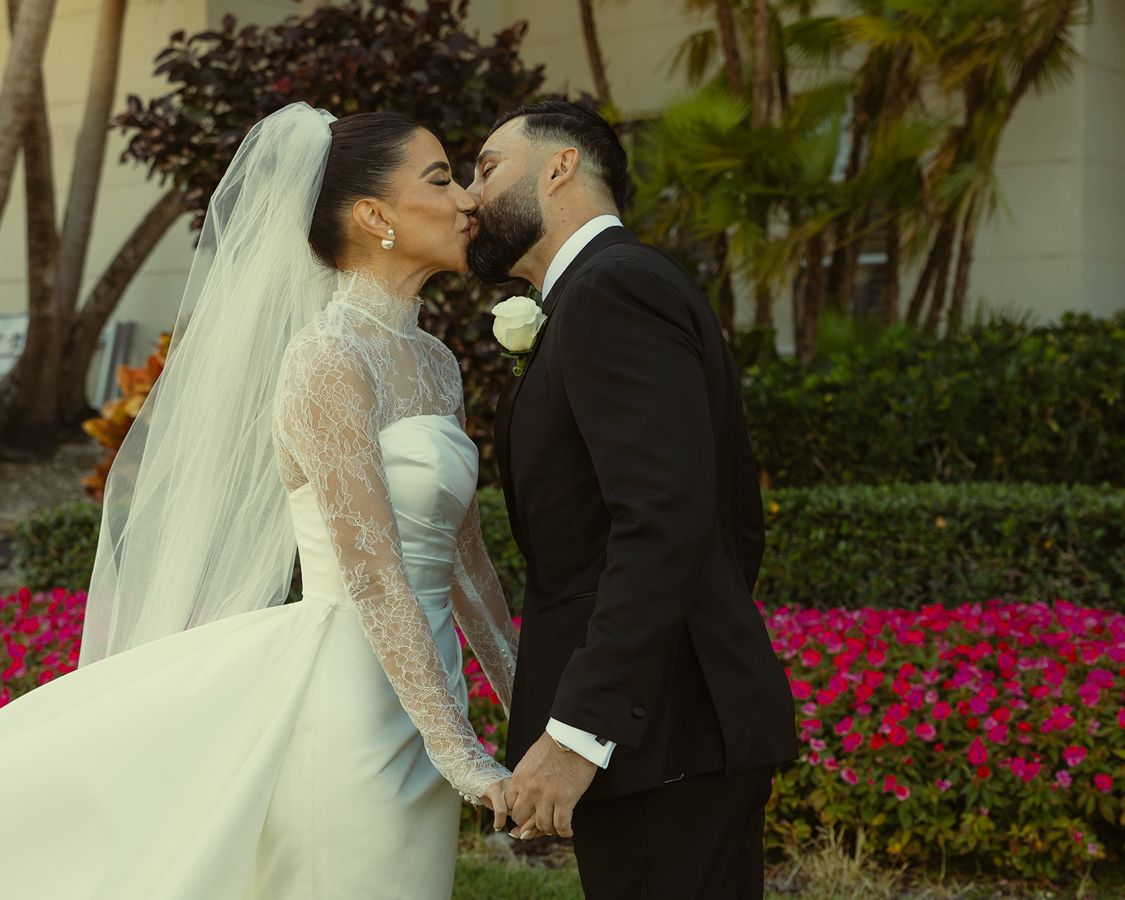 Bride and Groom Kissing during First Look holding hands for wedding at JW Marriott Turnberry Resort in Miami Authentic Reaction