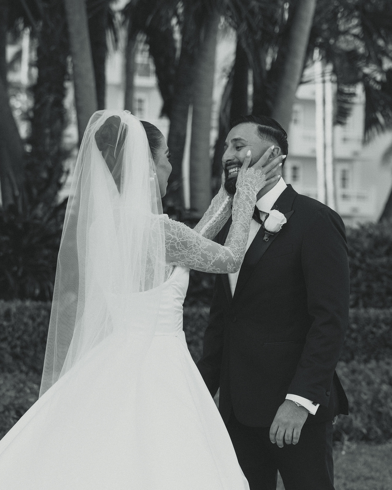 Bride and Groom First Look for wedding at JW Marriott Turnberry Resort in Miami Genuine Reaction Bride Grabbing Grooms Face in Black and White