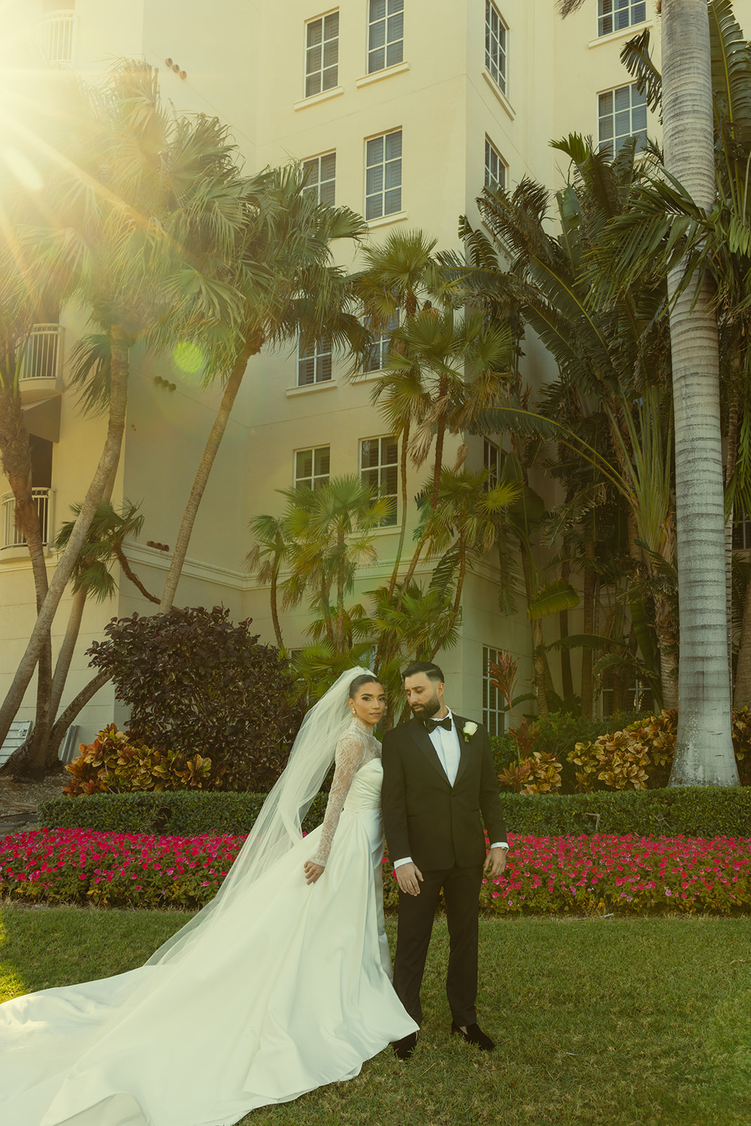 Editorial bride and groom wedding portraits with a sun flare. JW Marriott Turnberry in Miami. Documentary Wedding Photographer