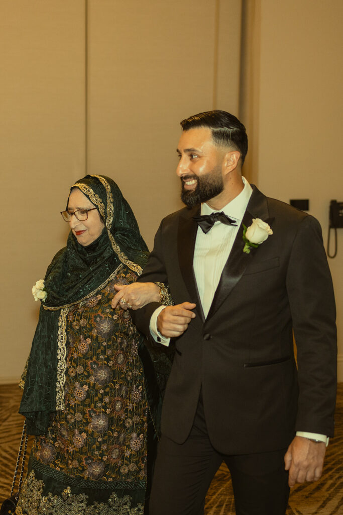 JW Marriott Turnberry Ballroom Wedding Ceremony Photography Groom and Mother Walking the Aisle