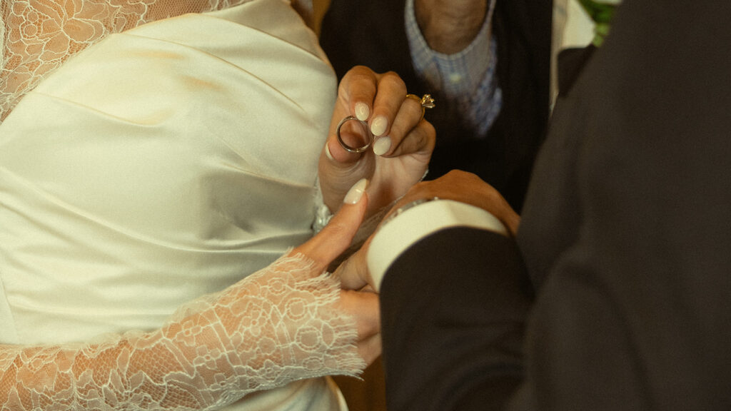 Bride Putting Groom Wedding Band JW Marriott Turnberry Ballroom Wedding Ceremony Photography