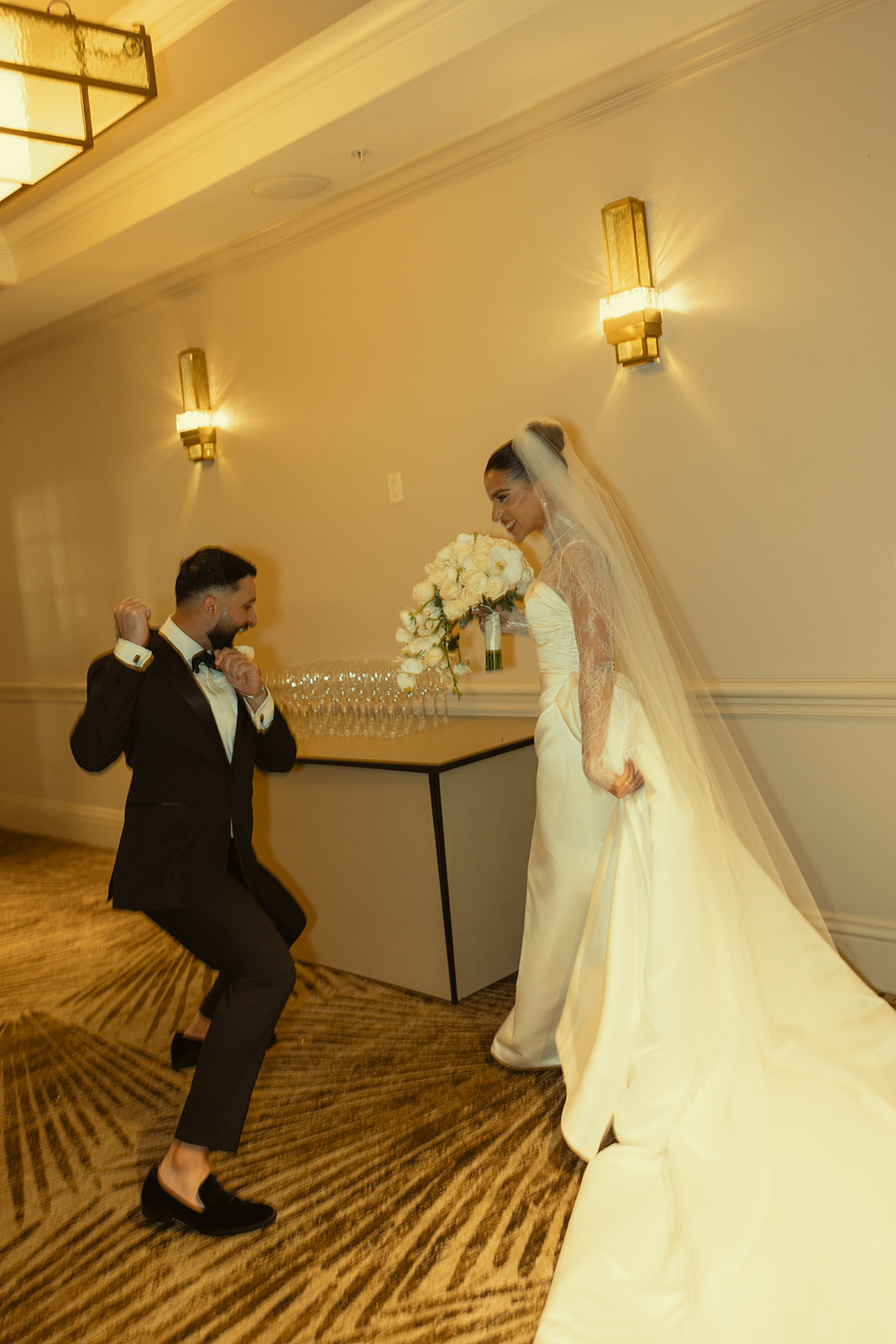 Bride and Groom Candid of them Dancing Cheering Laughing After Wedding Ceremony at JW Miami Turnberry. Ballroom Wedding Ceremony