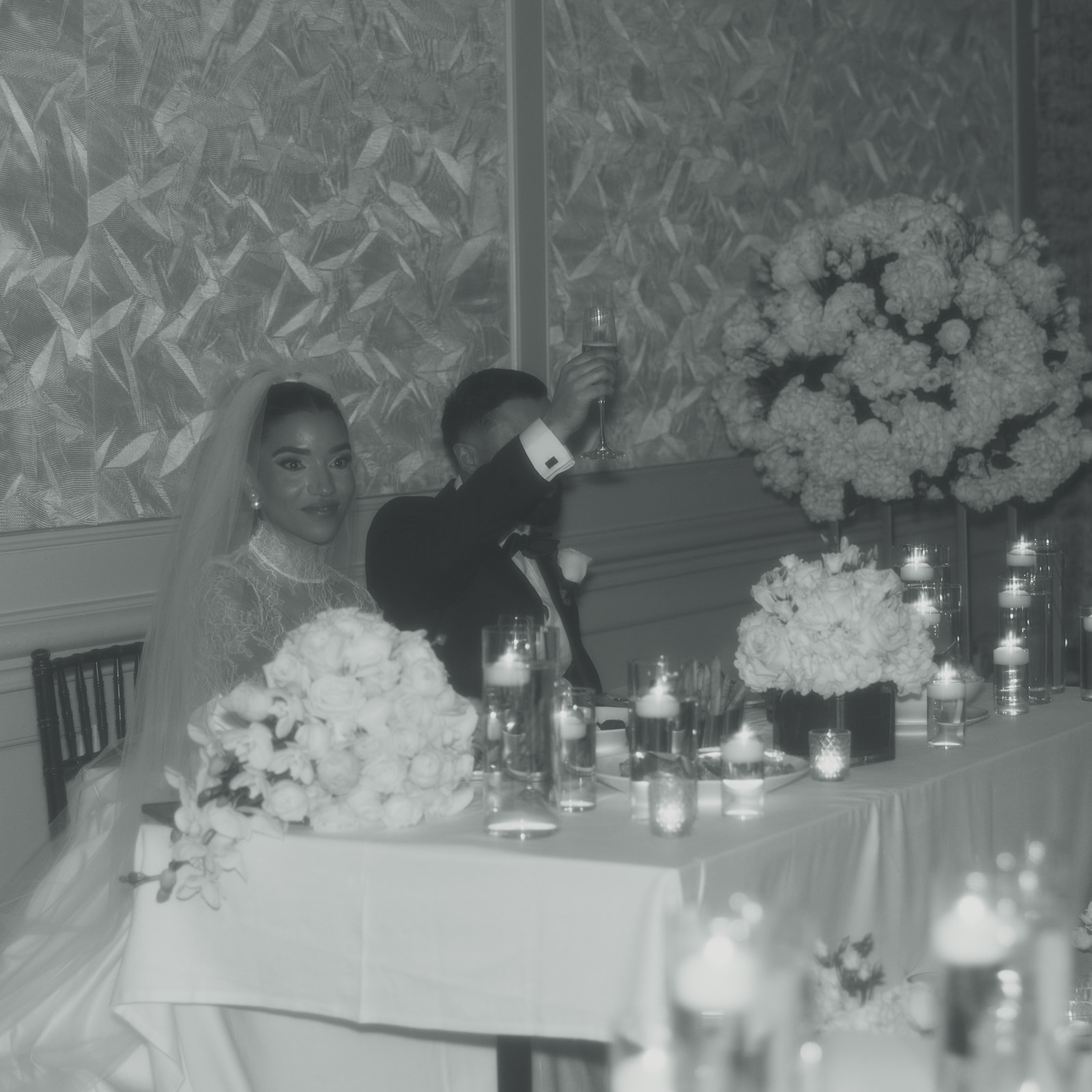 Bride & Groom Cheers during wedding speeches. JW Marriott Turnberry in Aventura Florida black and white