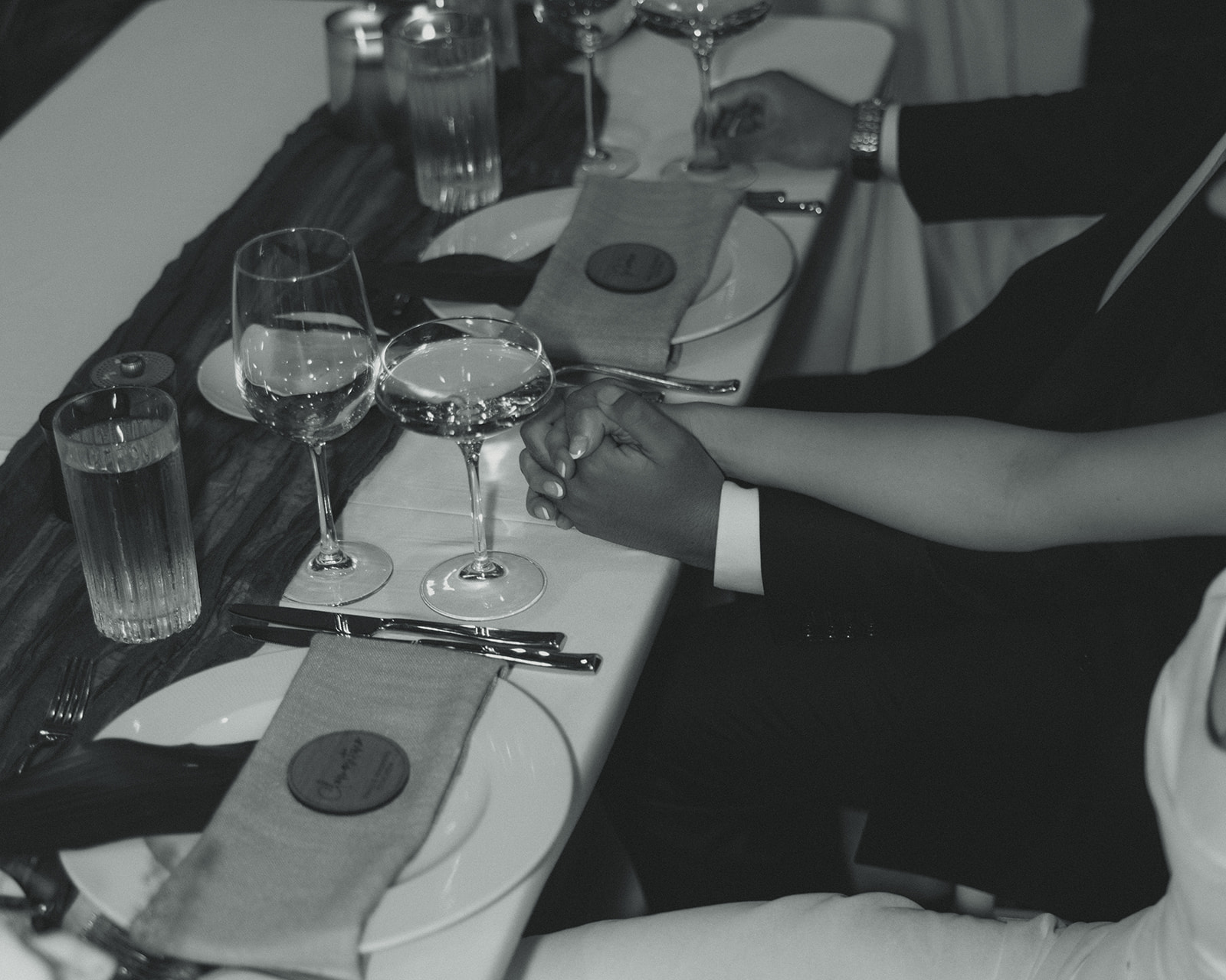 Bride and Groom Holding Hands Reception Timeless Wedding in Mayfair Hotel & Garden Black and White