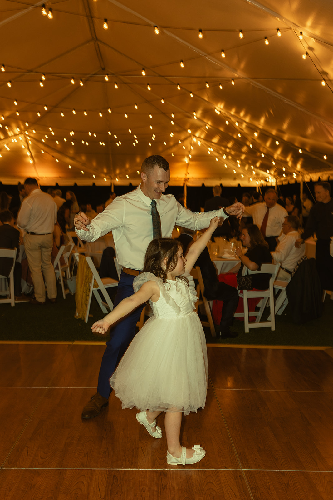 Guests twirling and dancing candids during reception. Wedding in West Florida, St Petersburg in Sunken Gardens