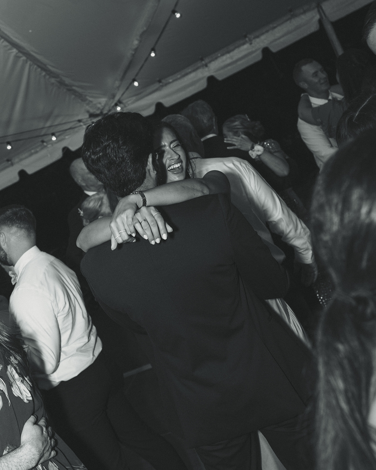 Guests smiling and dancing candids during reception. Wedding in West Florida, St Petersburg in Sunken Gardens black and white