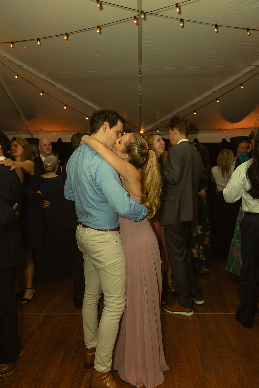 kissing couple candids during wedding reception. Wedding in West Florida, St Petersburg in Sunken Gardens