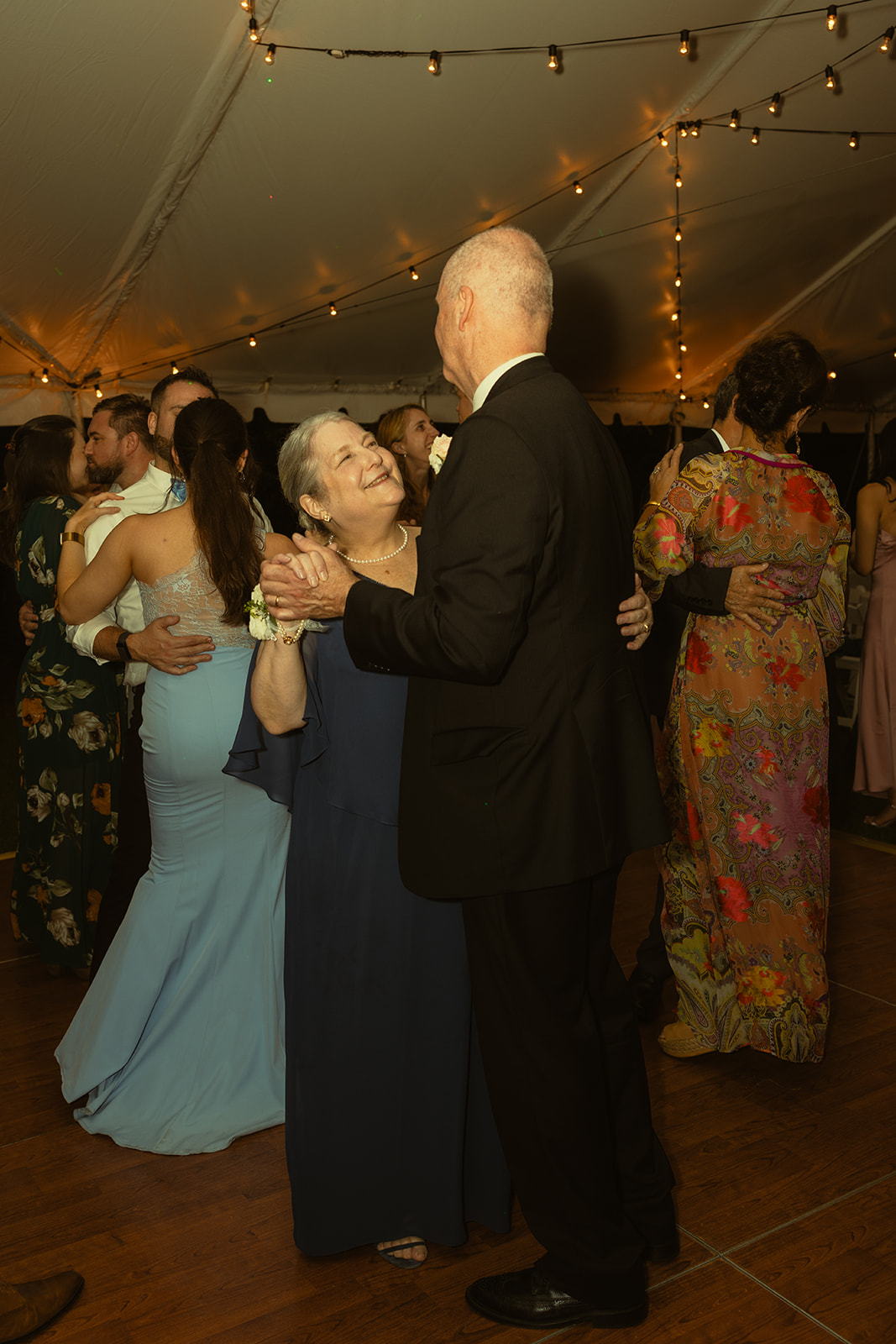 Guests smiling while dancing candids wedding reception. Wedding in West Florida, St Petersburg in Sunken Gardens in black and white