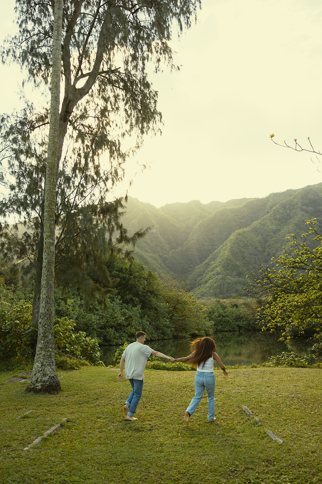 Lush Lakeside Mountains Oahu Hawaii Engagement Pictures Running Couple North Shore