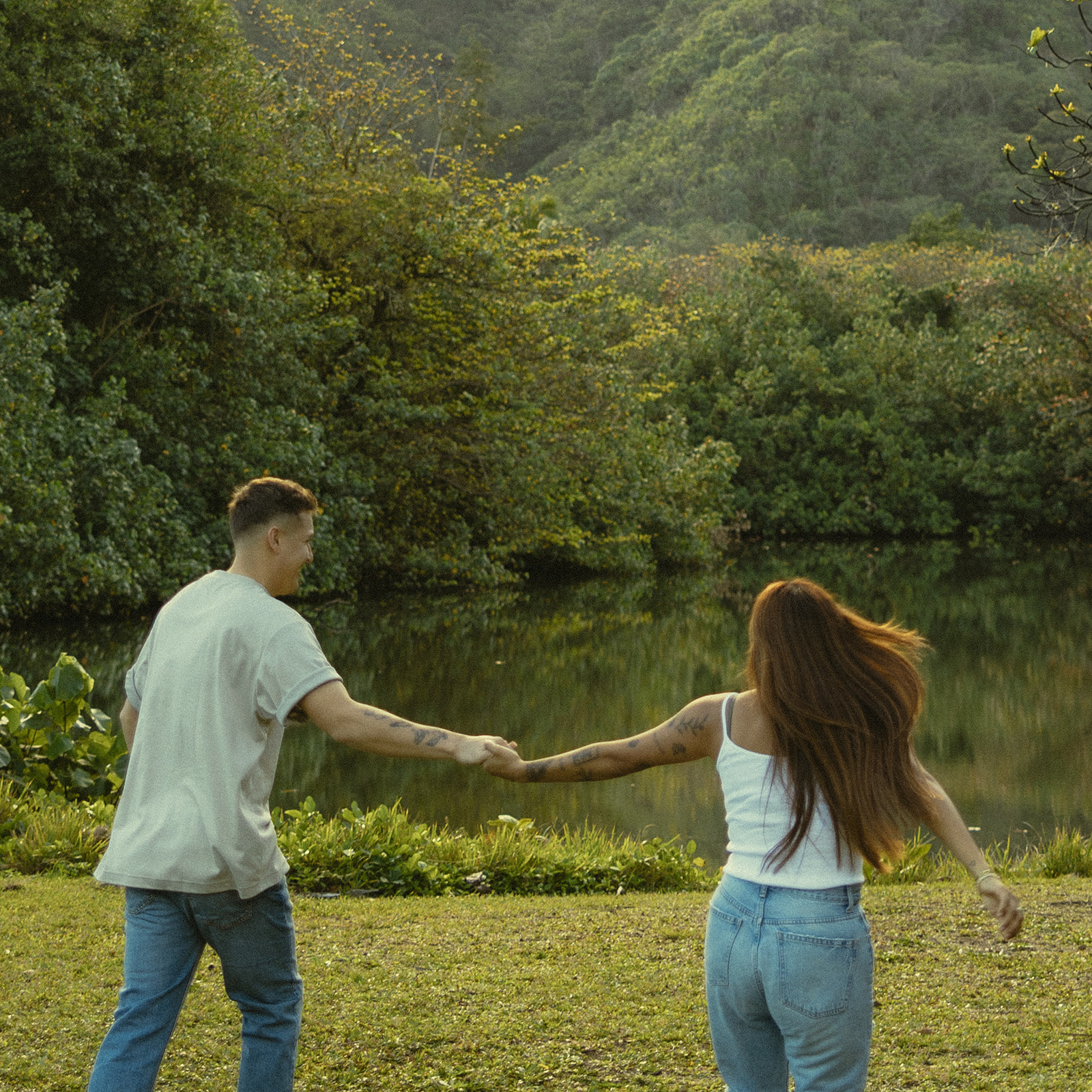 Lush Lakeside Mountains Oahu Hawaii Engagement Pictures Running Couple North Shore