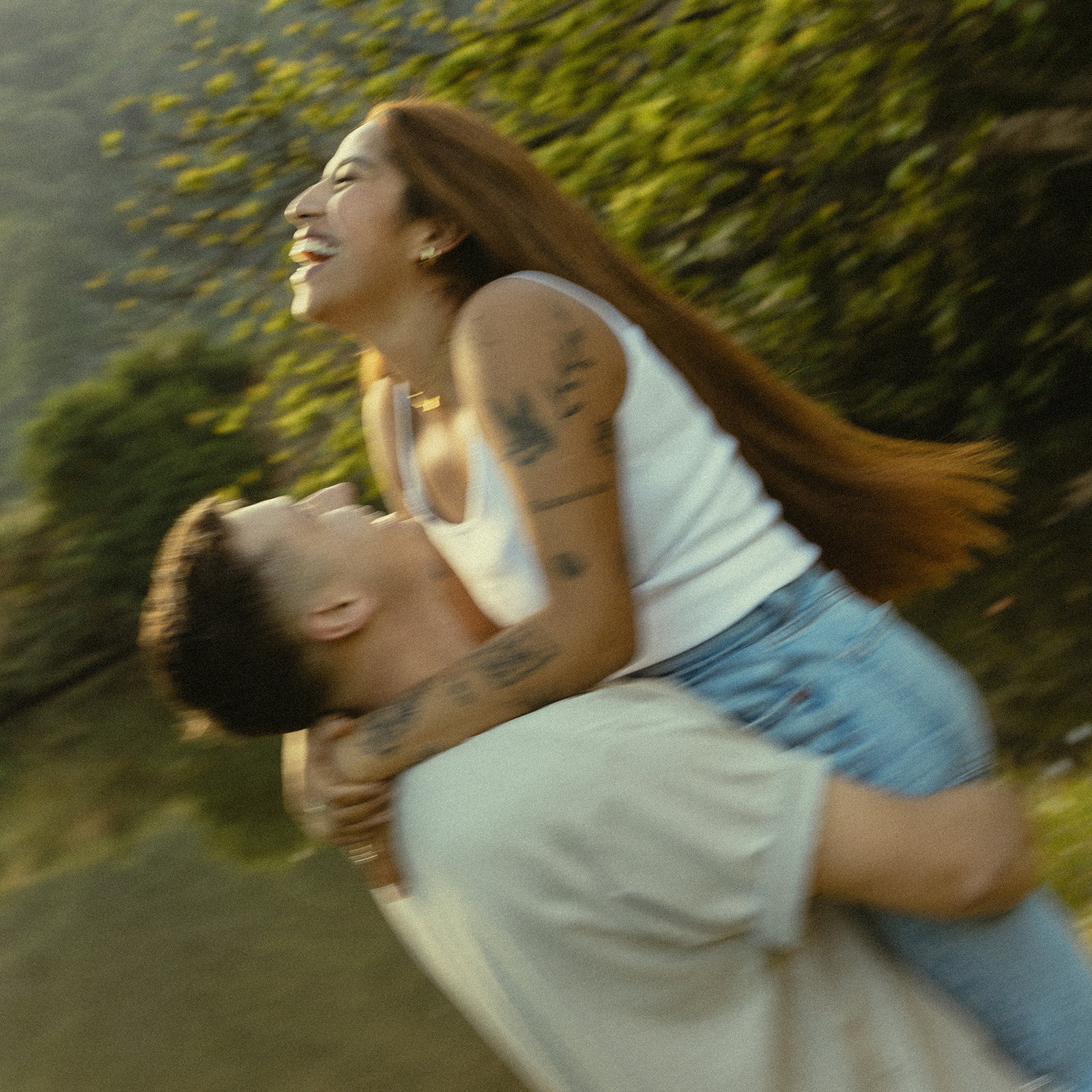 Lush Lakeside Mountains Oahu Hawaii Engagement Pictures Twirling and Dancing Laughing Couple North Shore