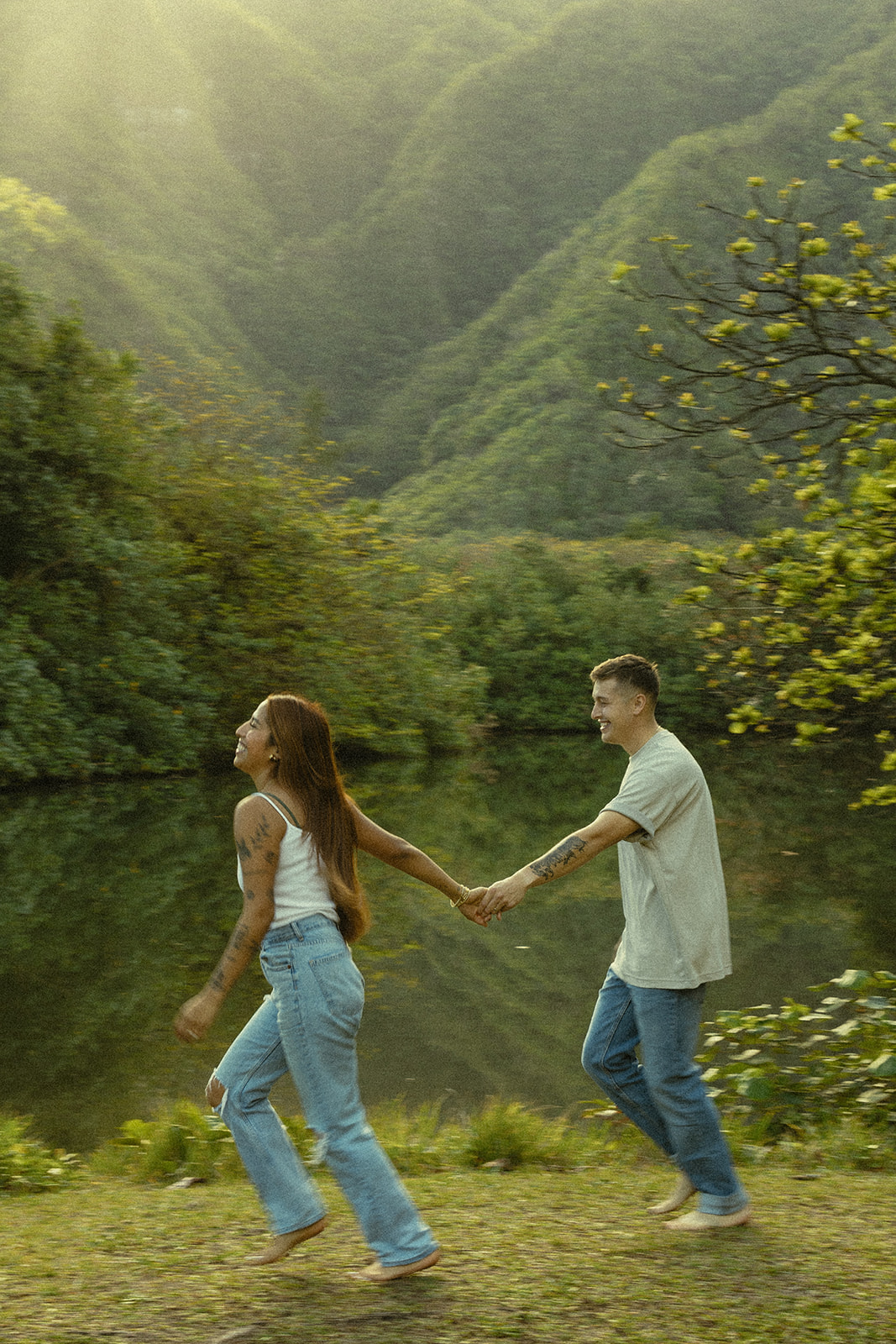 Lush Lakeside Mountains Oahu Hawaii Engagement Pictures Running Couple North Shore