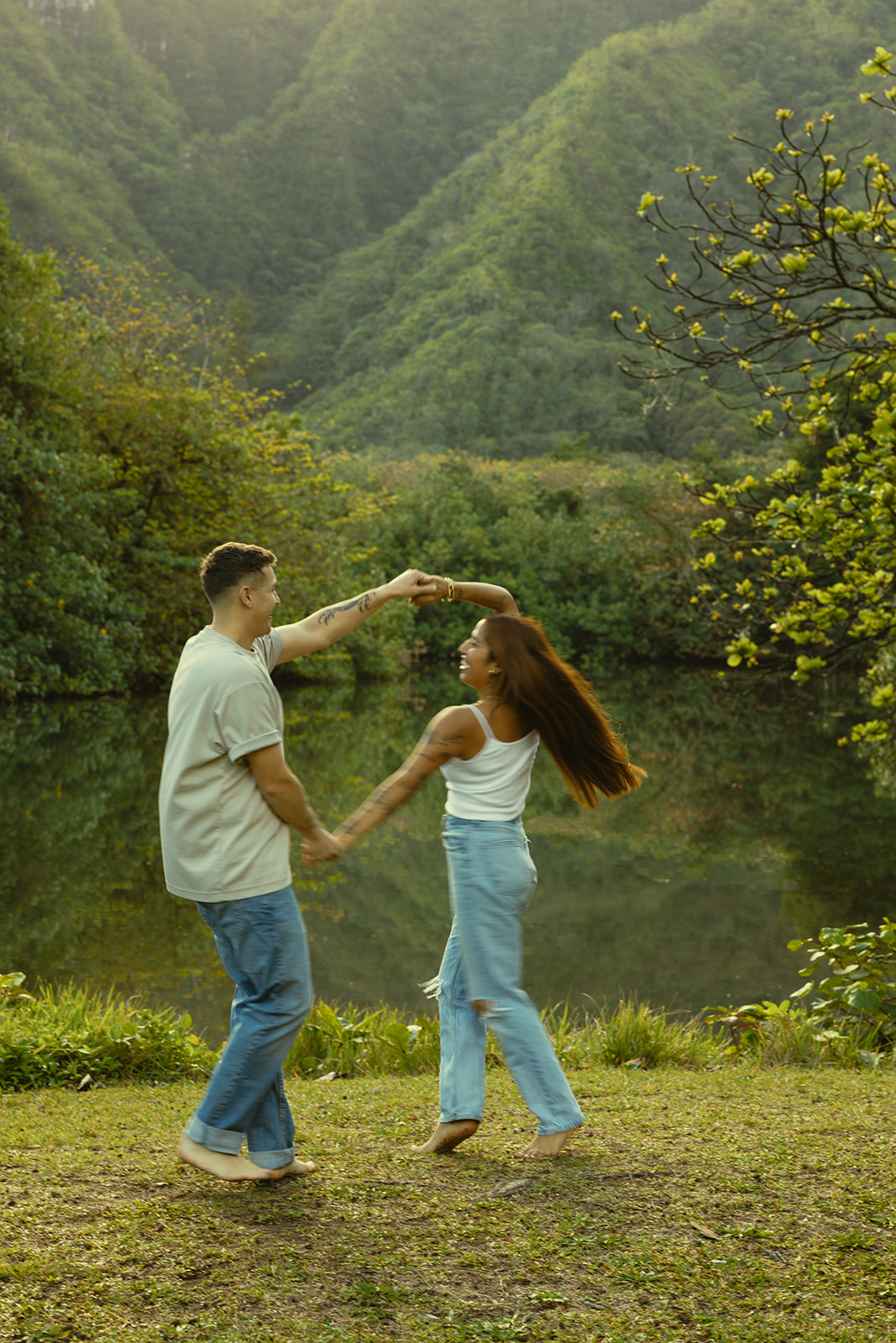 Lush Lakeside Mountains Oahu Hawaii Engagement Pictures Running Turning Couple North Shore