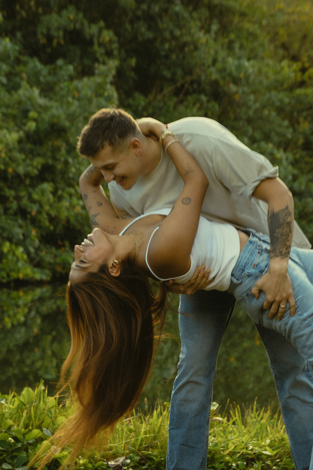 Lush Lakeside Mountains Oahu Hawaii Engagement Pictures Climbing Trees Couple North Shore