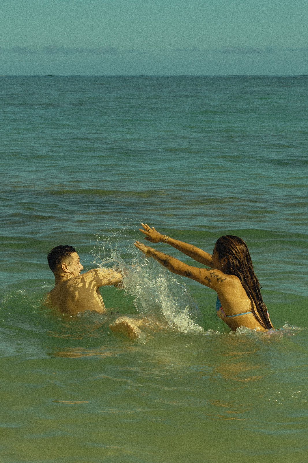 Backdrop Beach North Shore Oahu Hawaii Adventure PLayful Couple Pictures