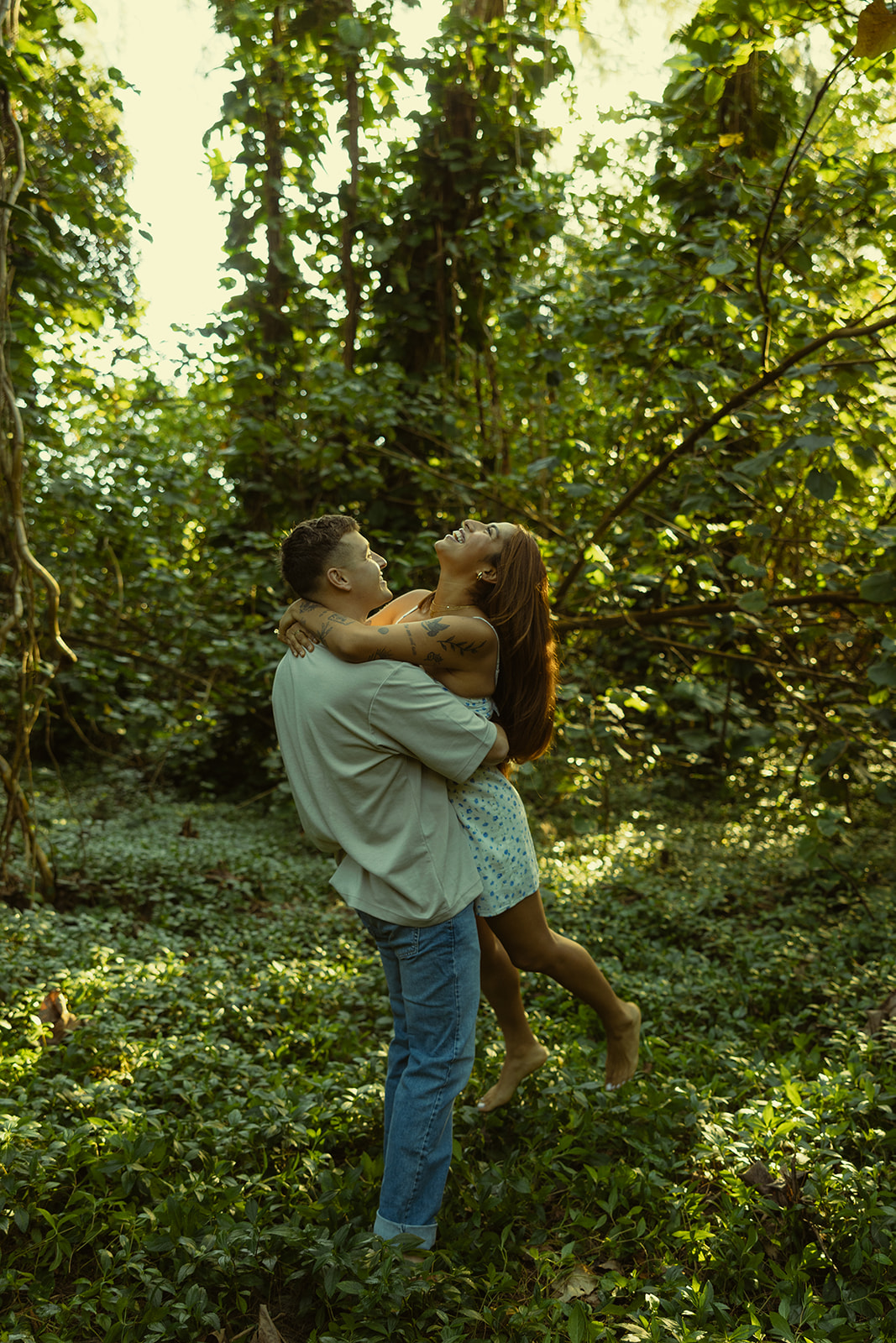 Lush Forest Oahu Hawaii Engagement Pictures Twirling Couple North Shore