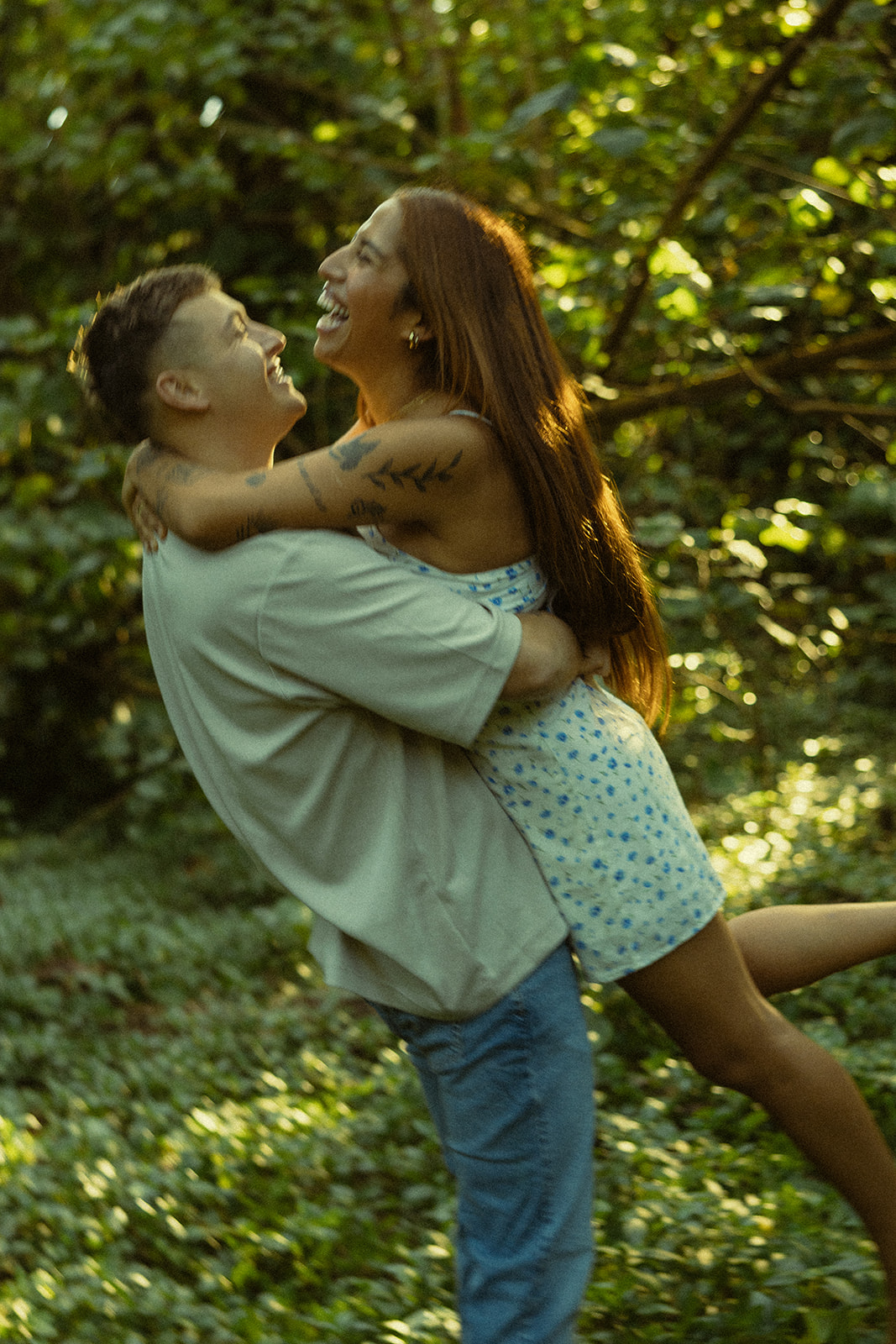 Lush Forest Oahu Hawaii Engagement Pictures Twirling Couple North Shore