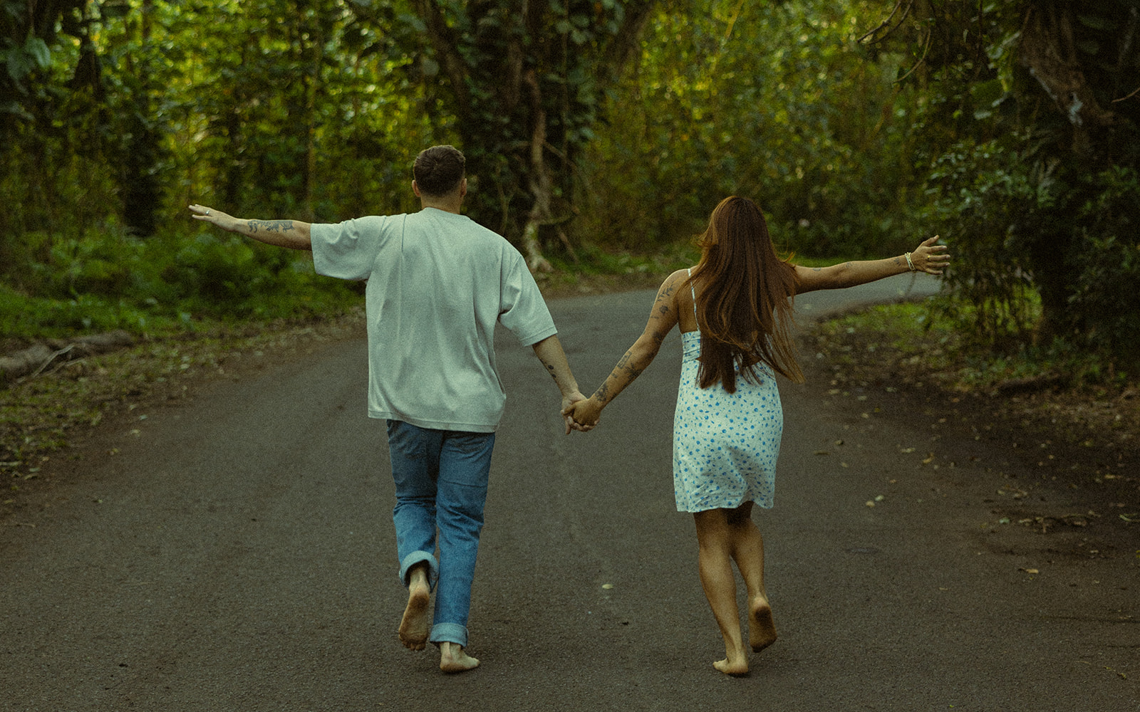 Lush Forest Oahu Hawaii Engagement Pictures Running Couple North Shore