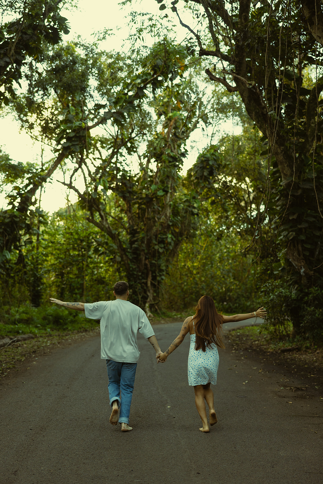 Lush Forest Oahu Hawaii Engagement Pictures Running Couple North Shore