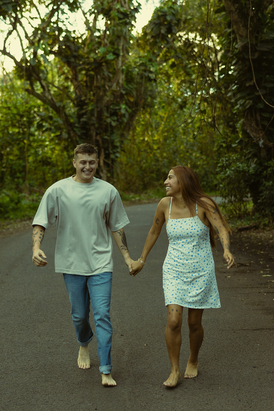 Lush Forest Oahu Hawaii Engagement Pictures Running Couple North Shore