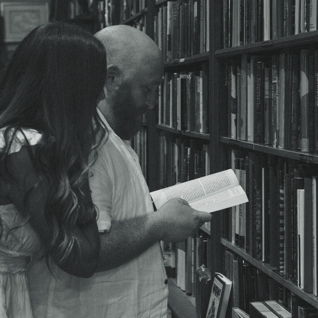 Black and White Bookstore Movie Still Engagement Session 