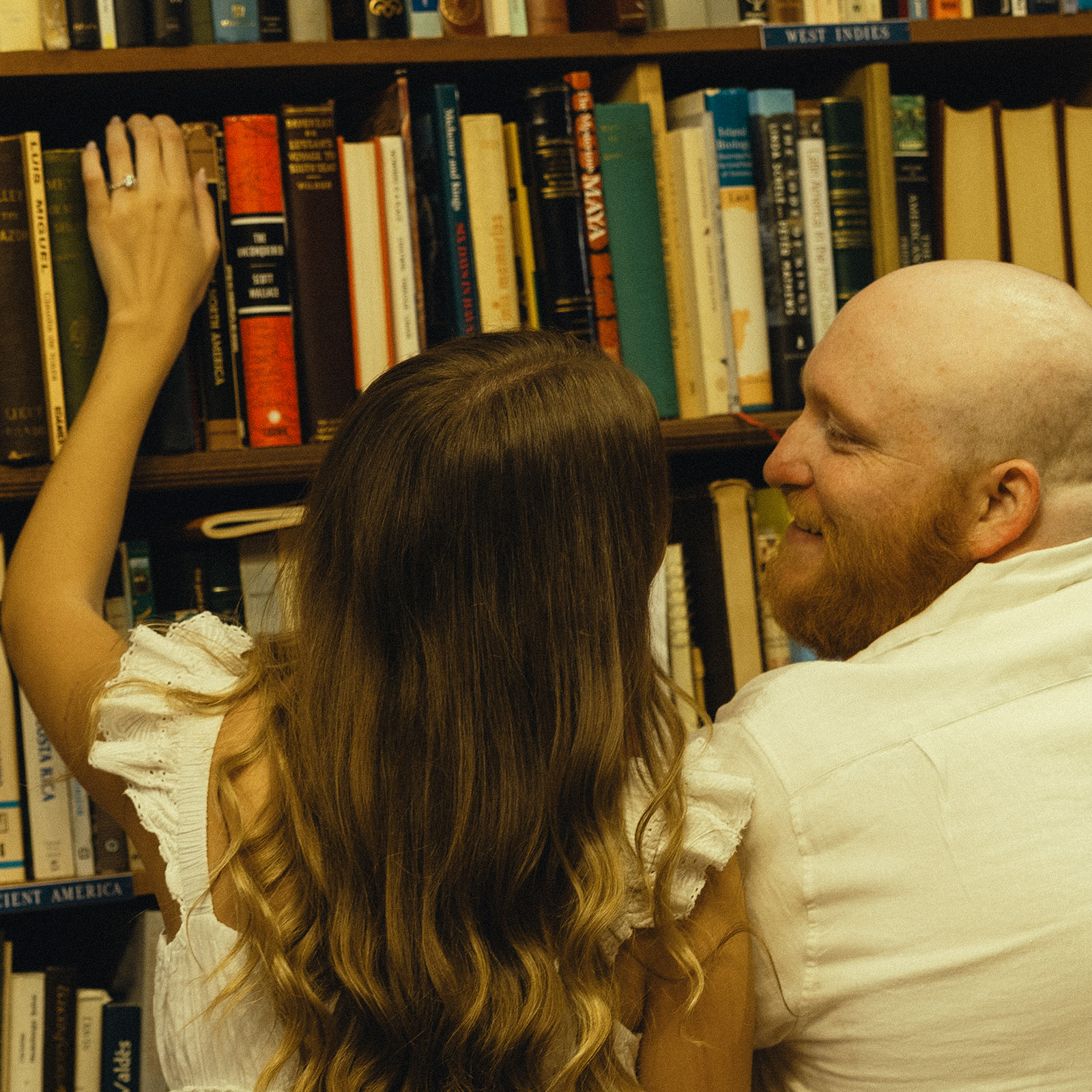 Movie Still Bookstore Documentary Engagement Session Miami Florida Wedding Photographer Laughing Couple