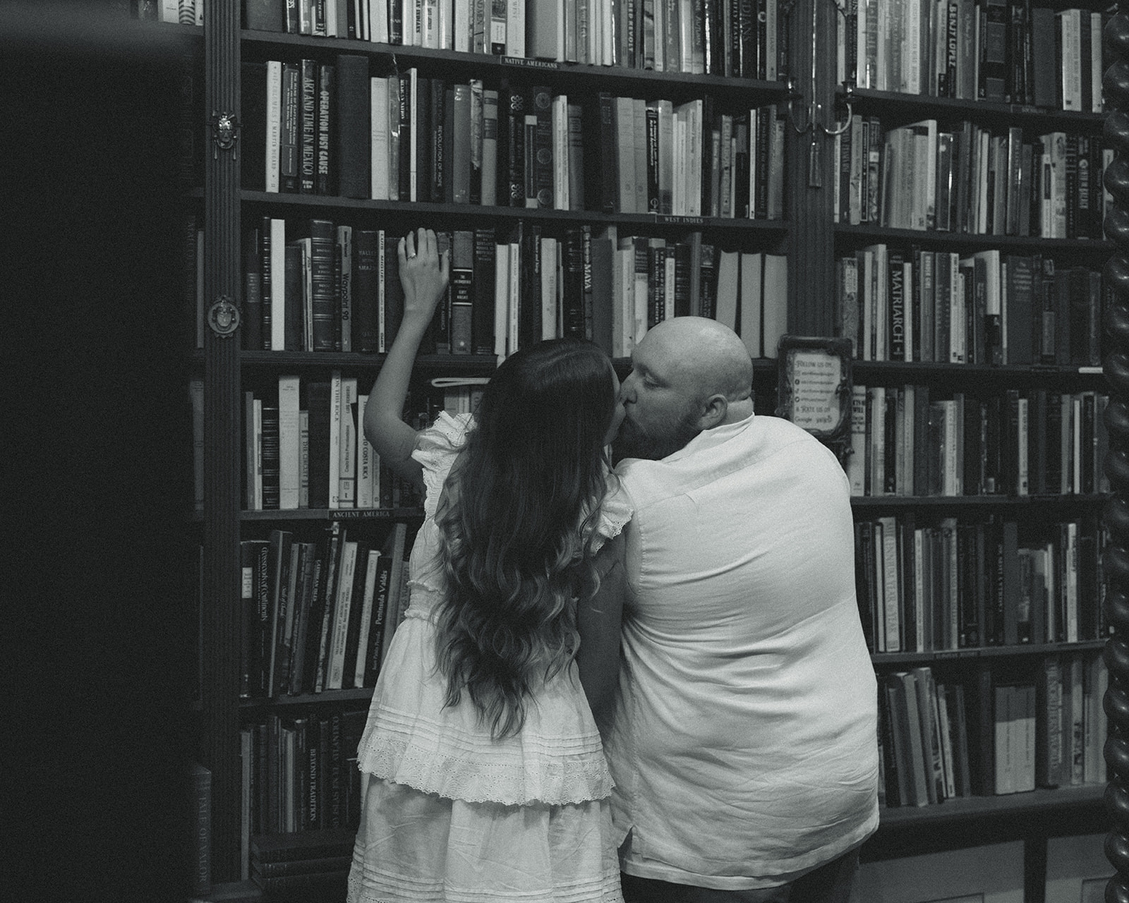 Black and White Historic Bookstore Movie Still Engagement Session Miami Florida Engagement Session Kissing Couple