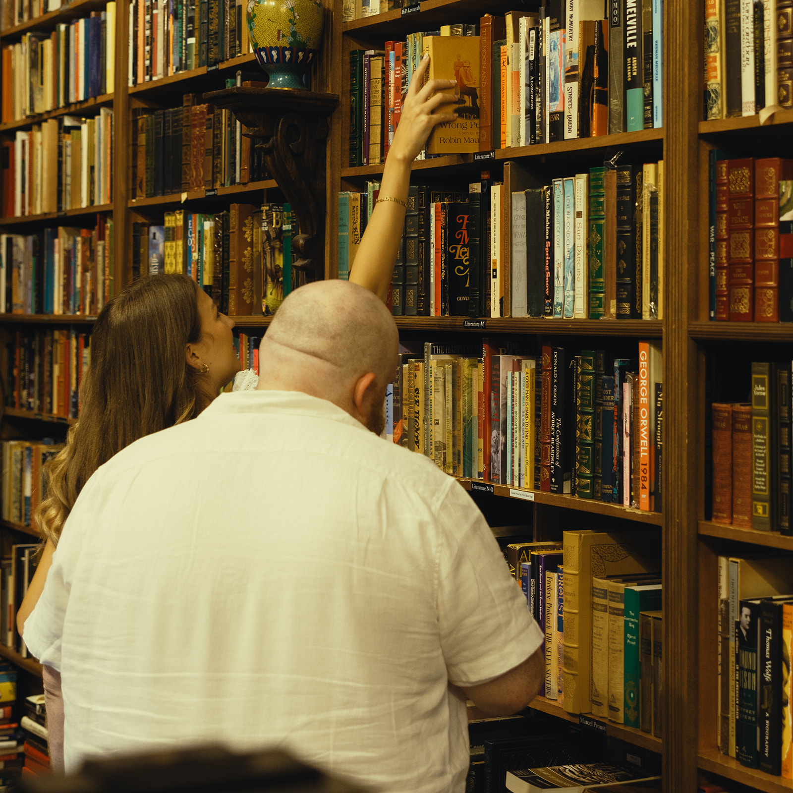 Movie Still Bookstore Documentary Engagement Session Miami Florida Wedding Photographer Girl Reaching Books