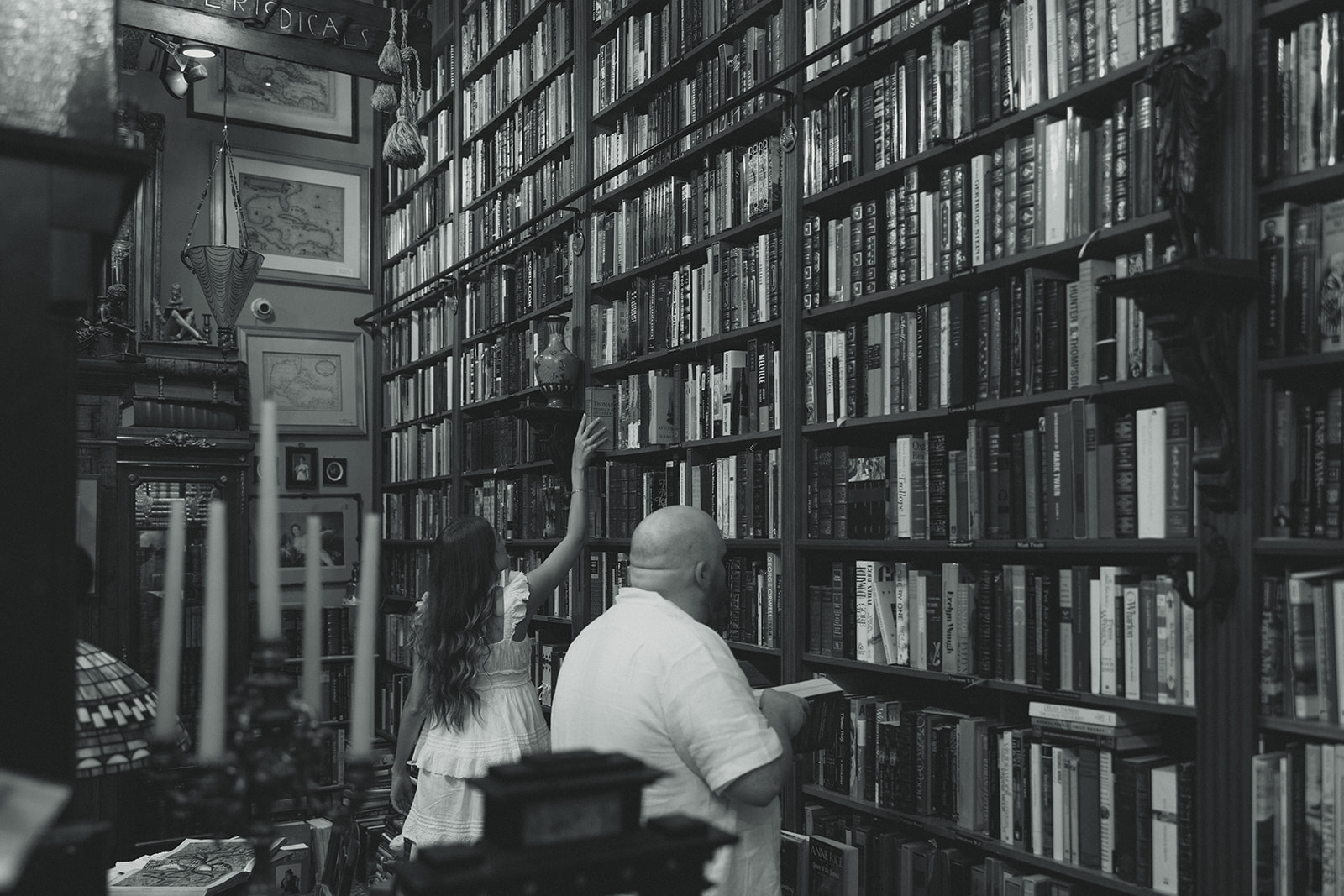 Black and White Bookstore Movie Scene Engagement Session Couple Candid