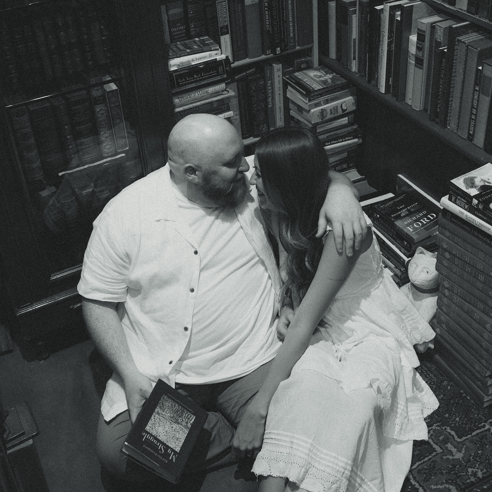 Black and White Bookstore Movie Still Engagement Session