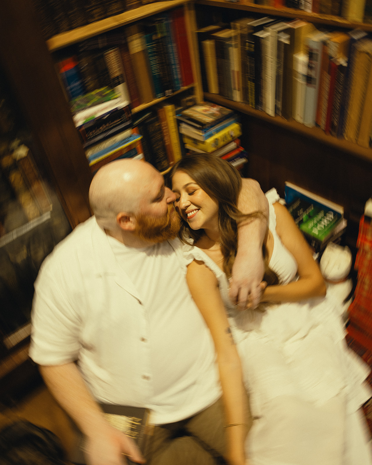 Laughing Motion Blur Bookstore Movie Scene Engagement Session