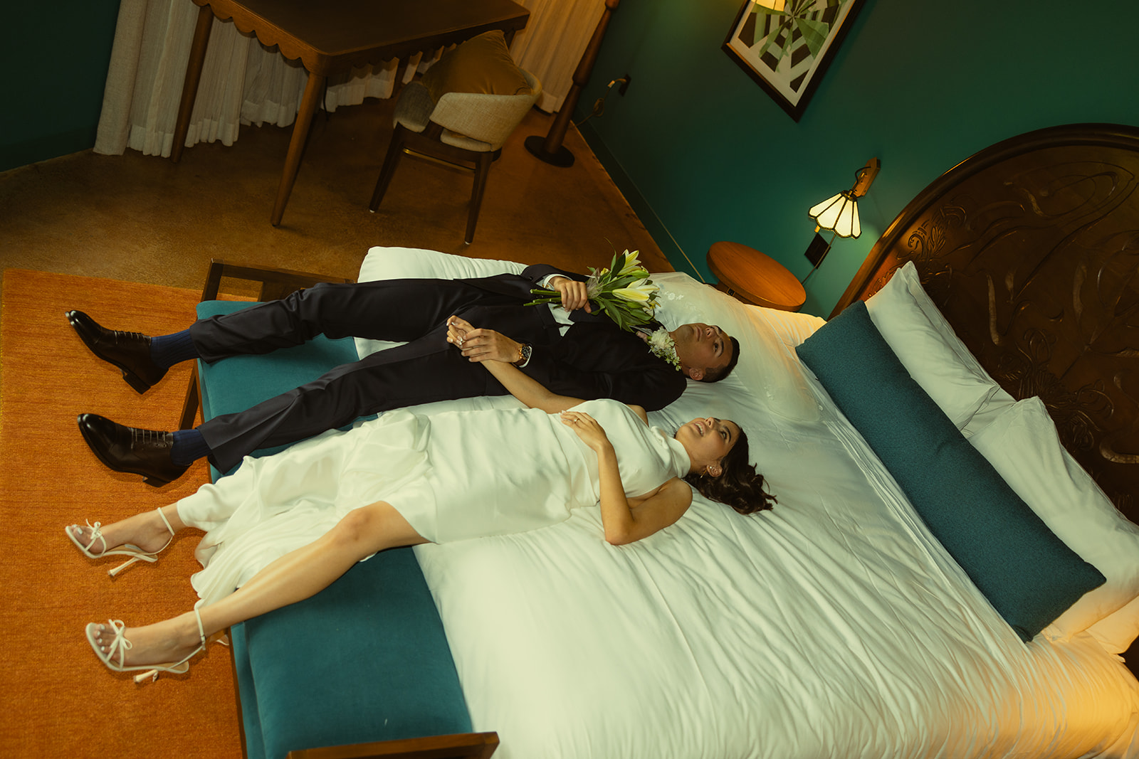 Bride and Groom Laying on Bed Wedding Portraits at Mayfair Hotel & Garden Coconut Grove 