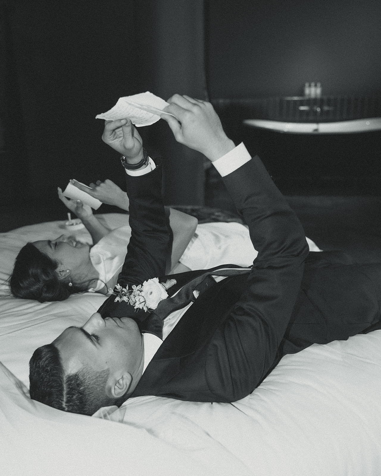 Bride and Groom Reading Vows on Bed Wedding Portraits at Mayfair Hotel & Garden Coconut Grove 